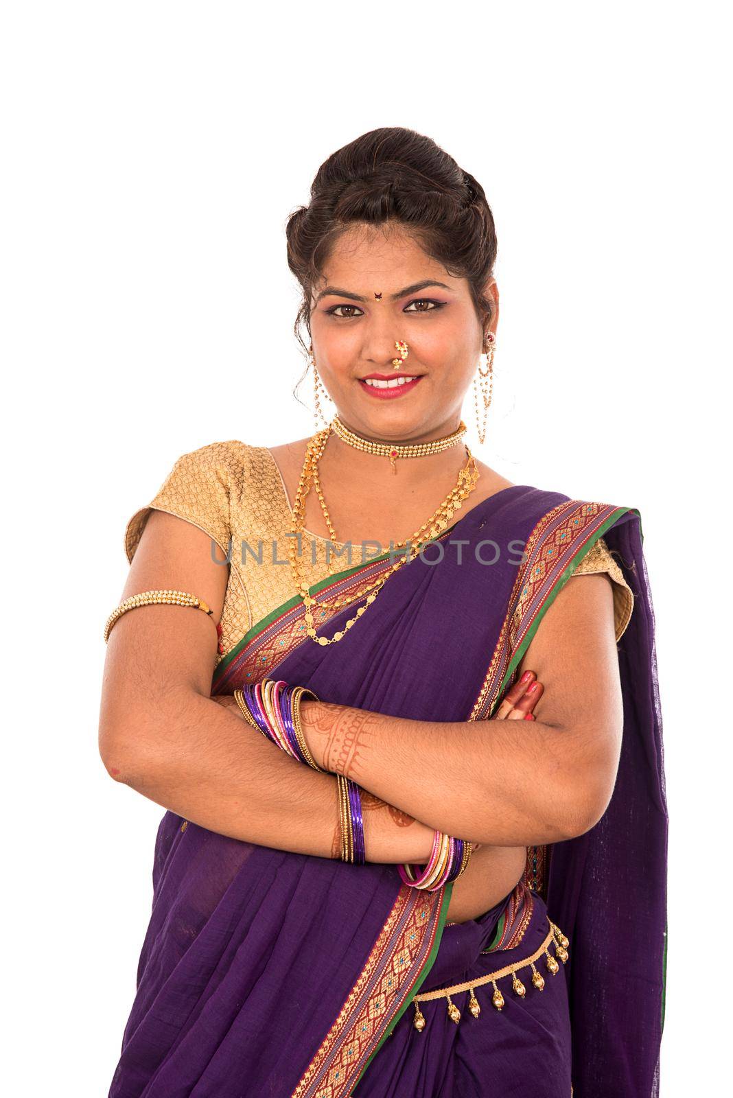 Close up of Beautiful Indian Traditional young girl in saree on white background by DipakShelare