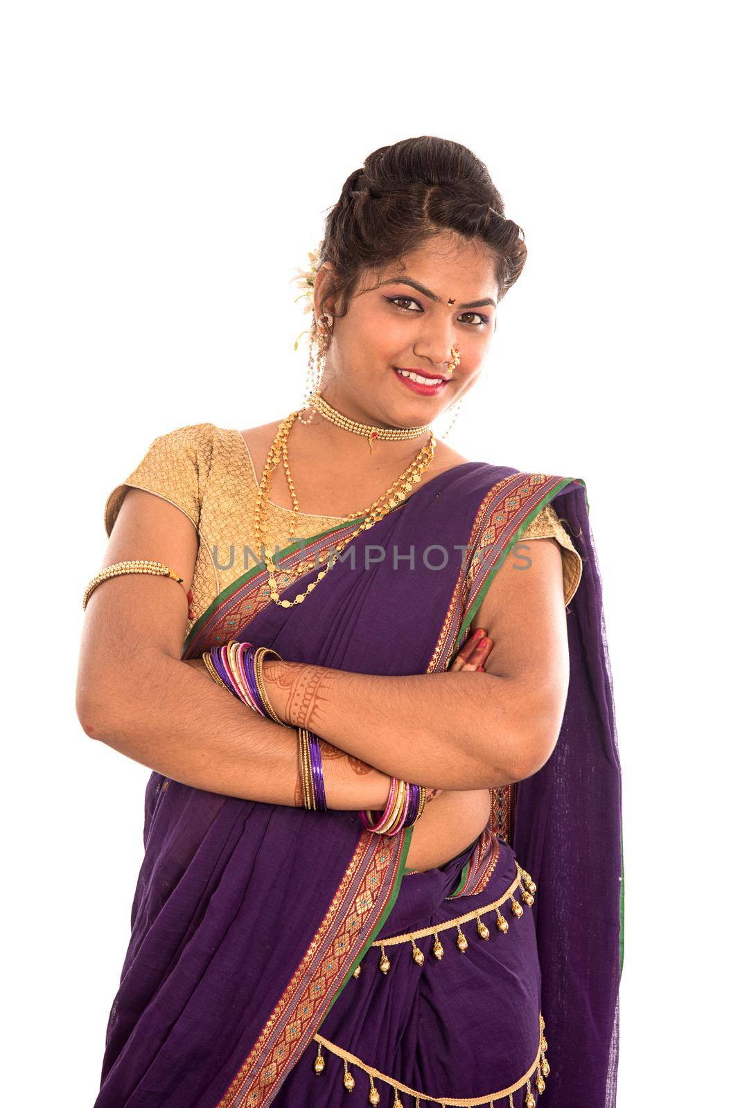 Close up of Beautiful Indian Traditional young girl in saree on white background by DipakShelare