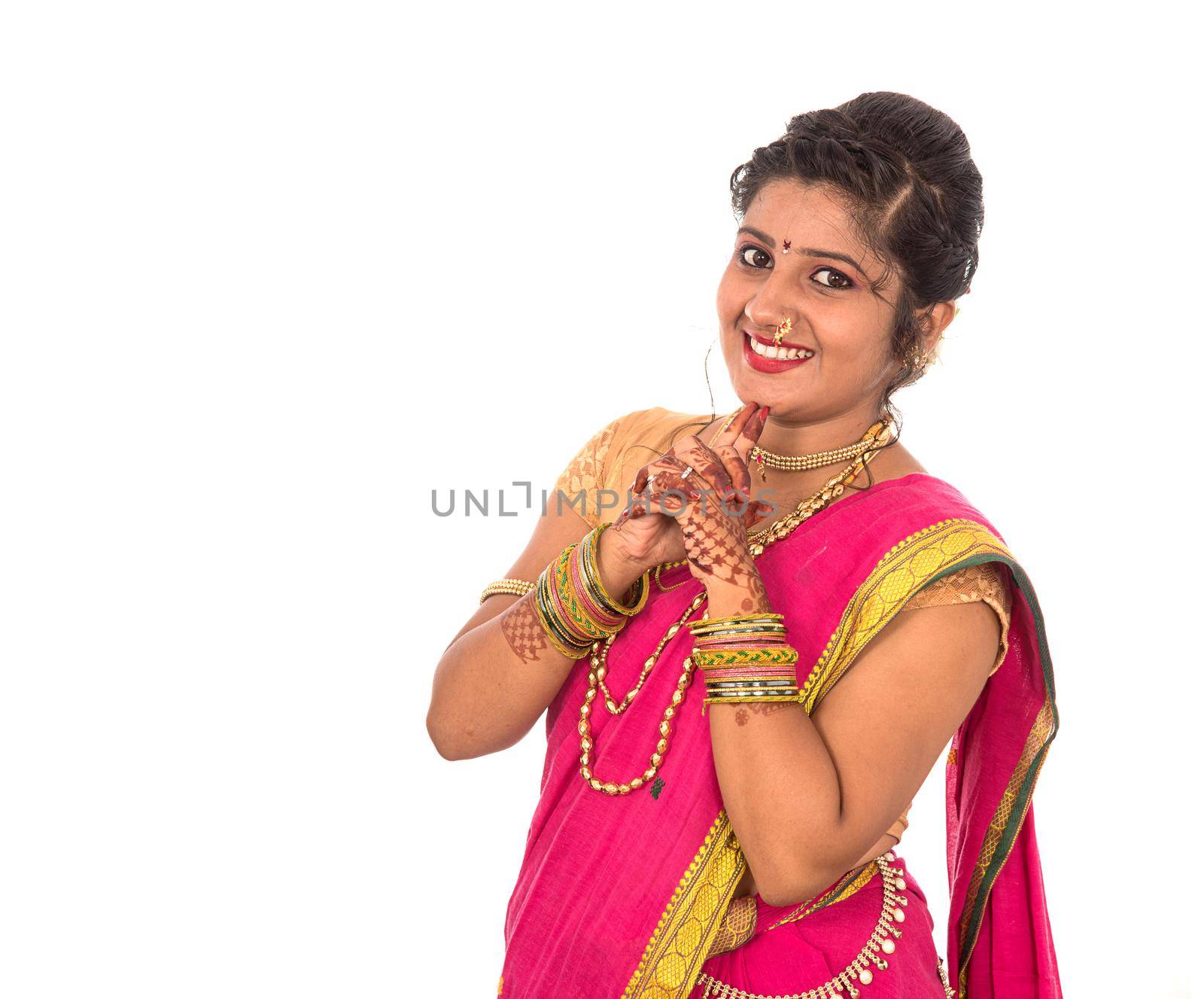 Close up of Beautiful Indian Traditional young girl in saree on white background by DipakShelare