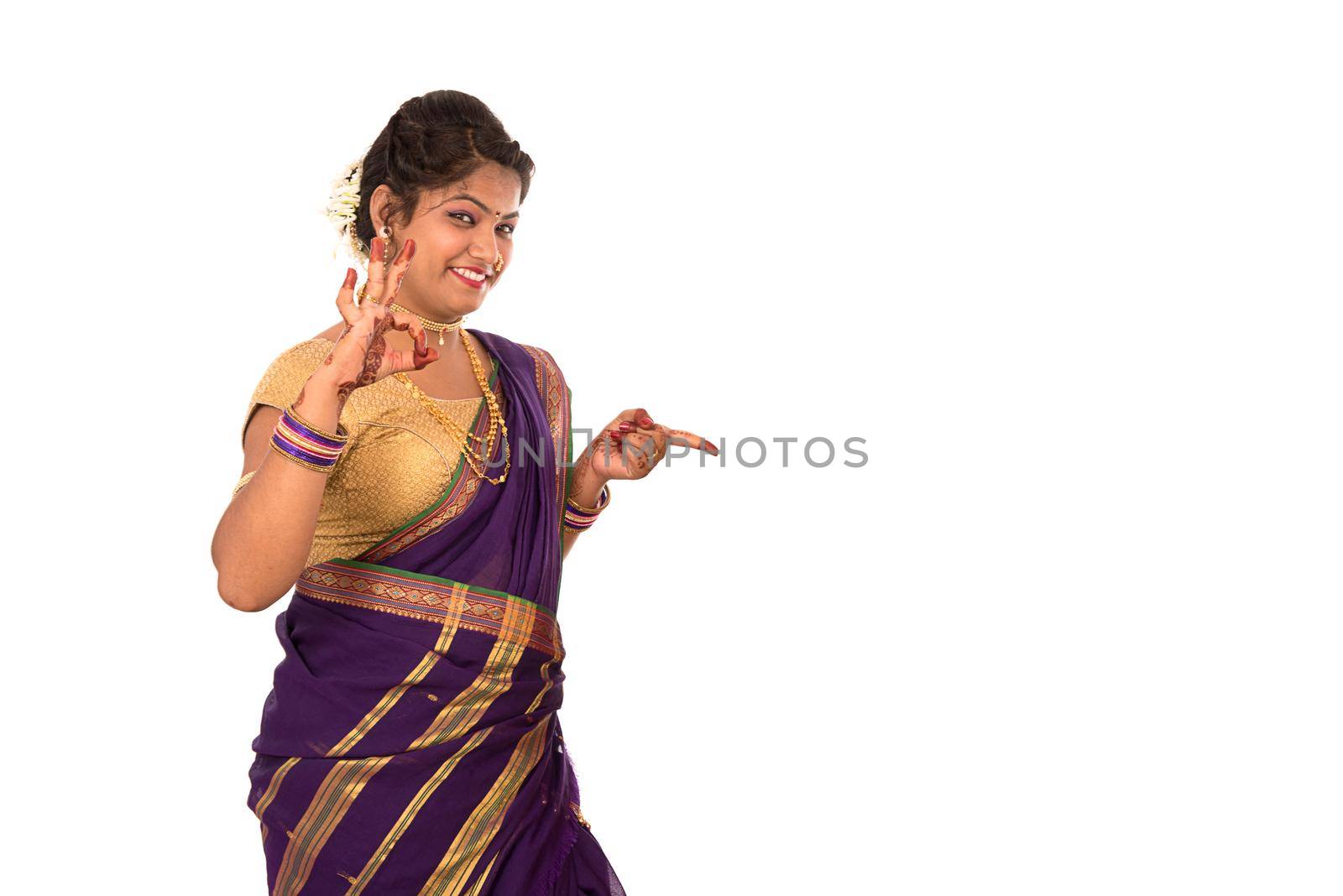 Close up of Beautiful Indian Traditional young girl in saree on white background by DipakShelare