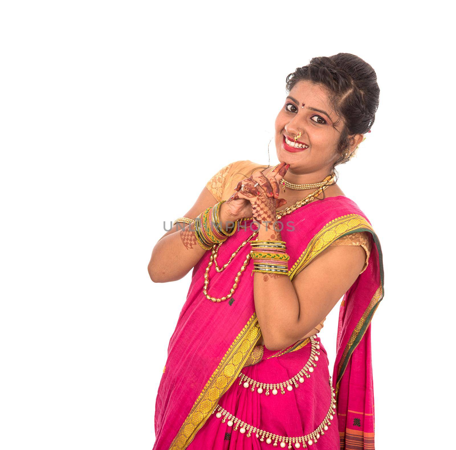 Close up of Beautiful Indian Traditional young girl in saree on white background by DipakShelare