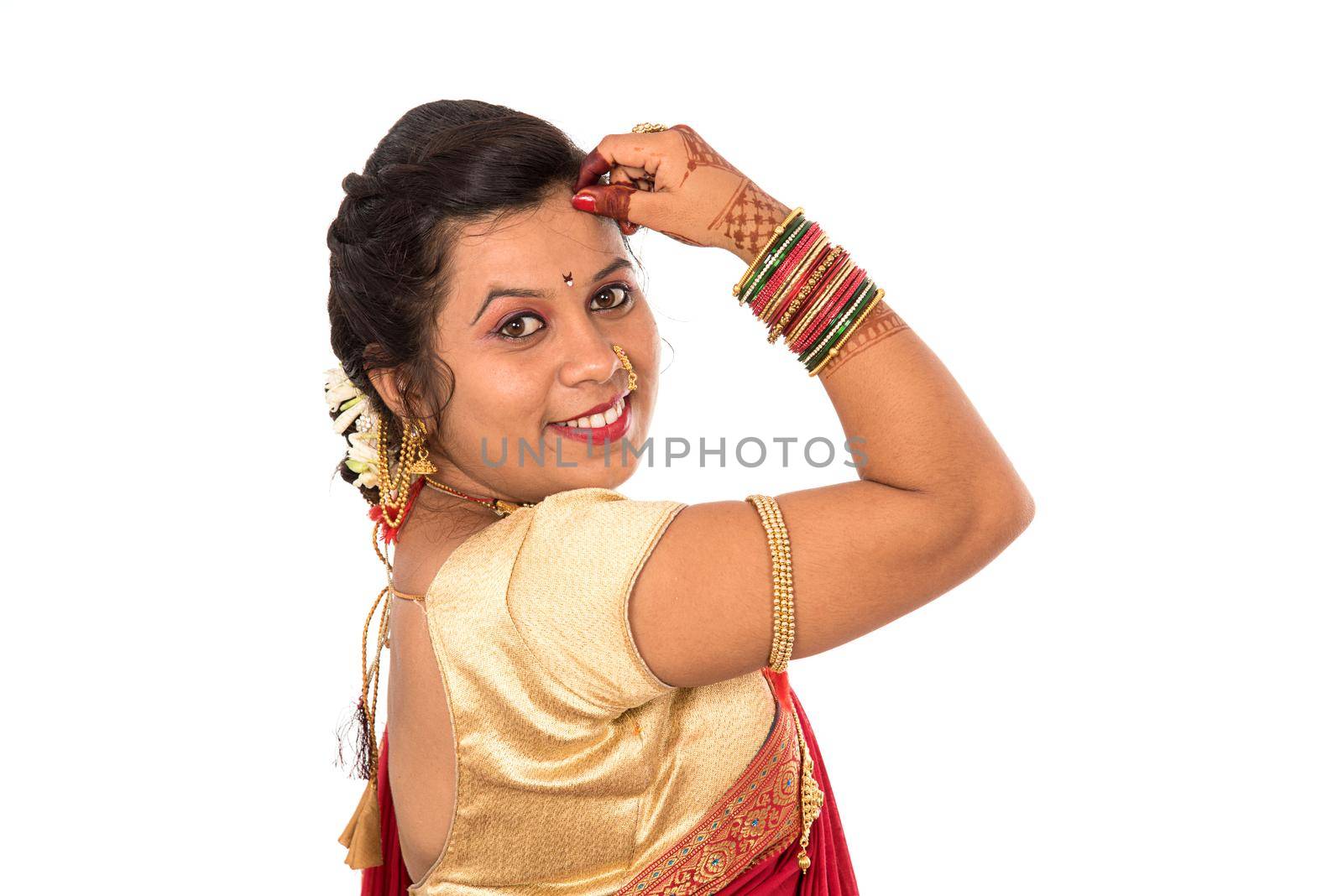 Close up of Beautiful Indian Traditional young girl in saree on white background by DipakShelare