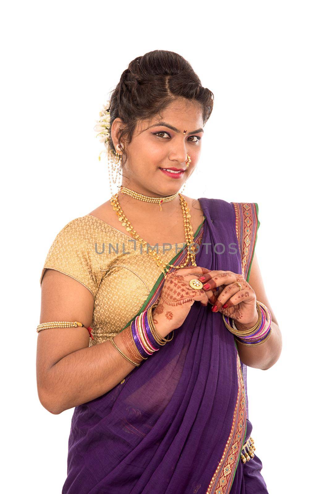 Close up of Beautiful Indian Traditional young girl in saree on white background by DipakShelare
