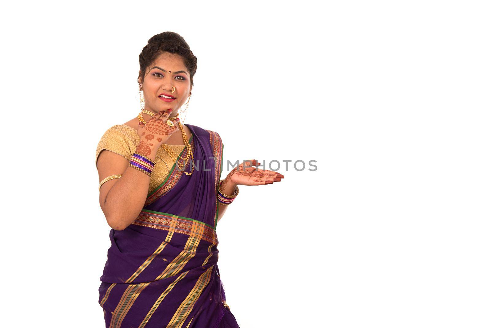 Close up of Beautiful Indian Traditional young girl in saree on white background by DipakShelare