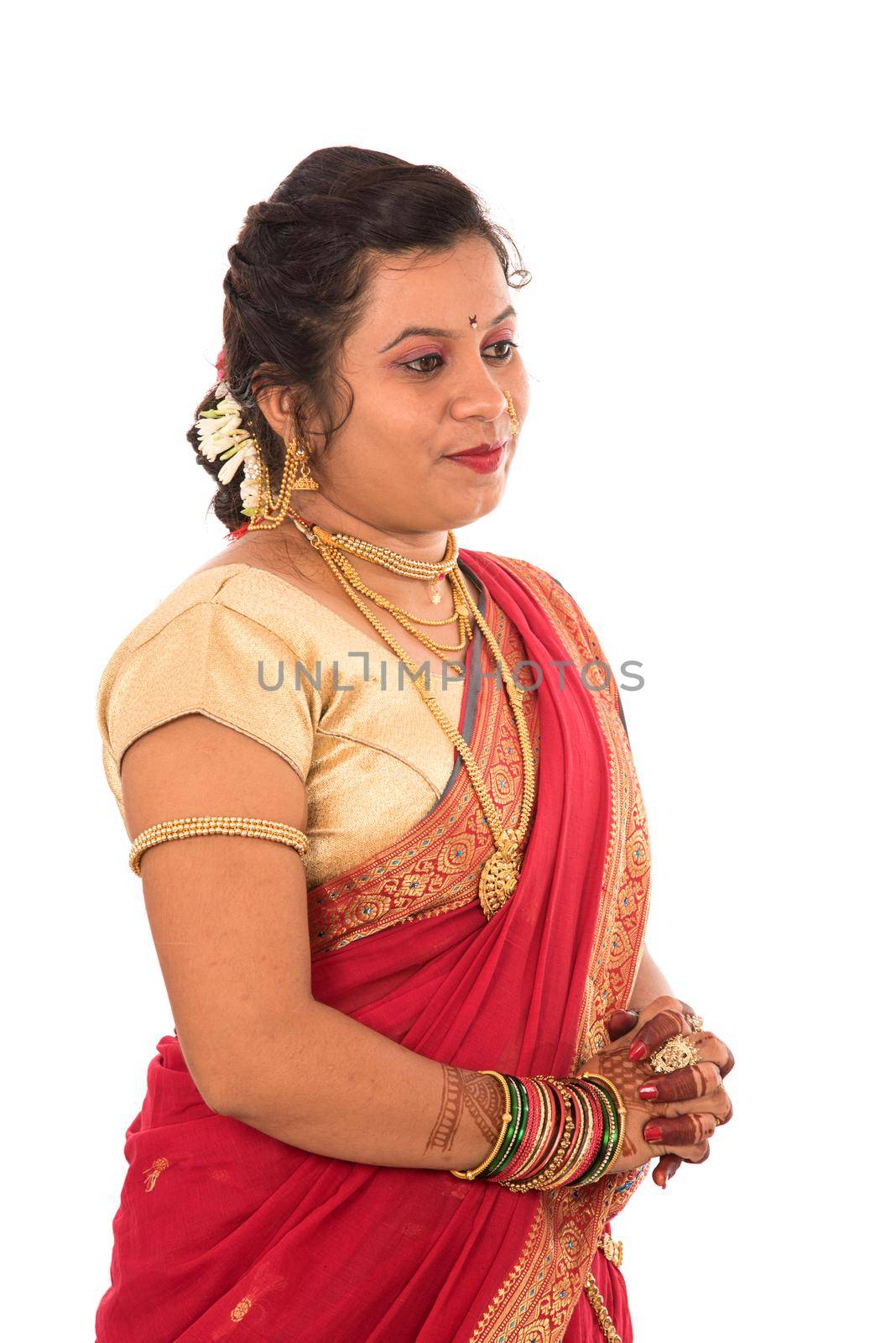 Close up of Beautiful Indian Traditional young girl in saree on white background by DipakShelare