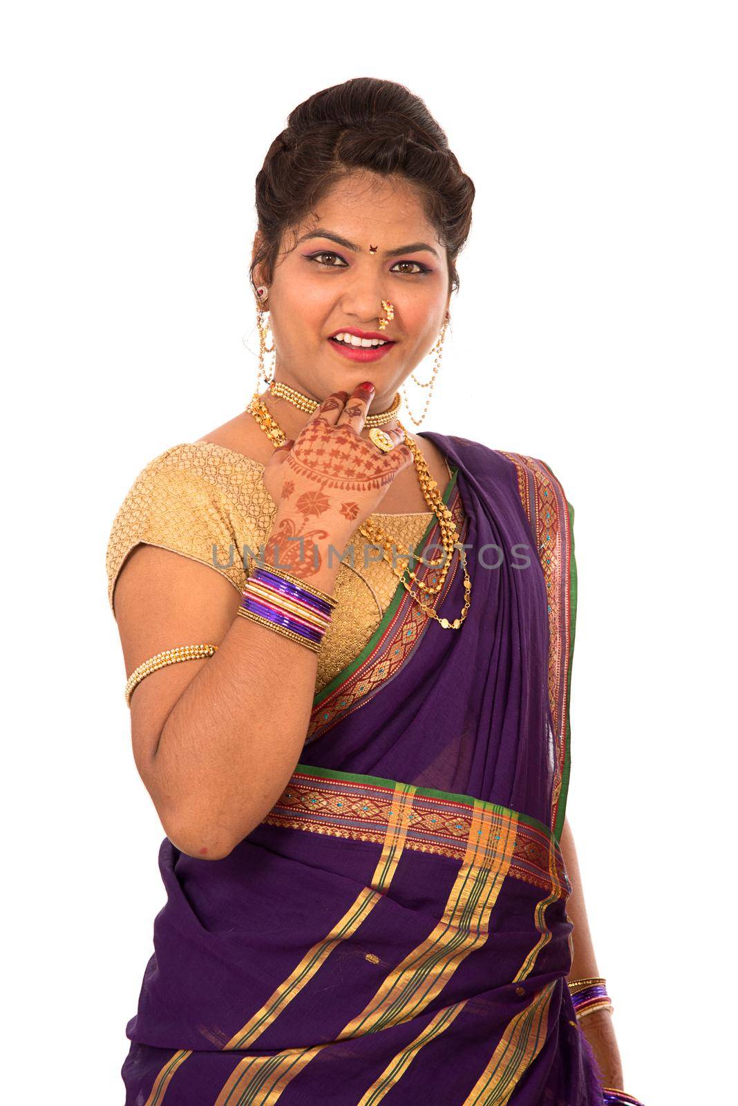 Close up of Beautiful Indian Traditional young girl in saree on white background by DipakShelare