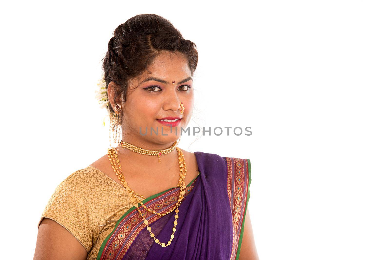 Close up of Beautiful Indian Traditional young girl in saree on white background by DipakShelare