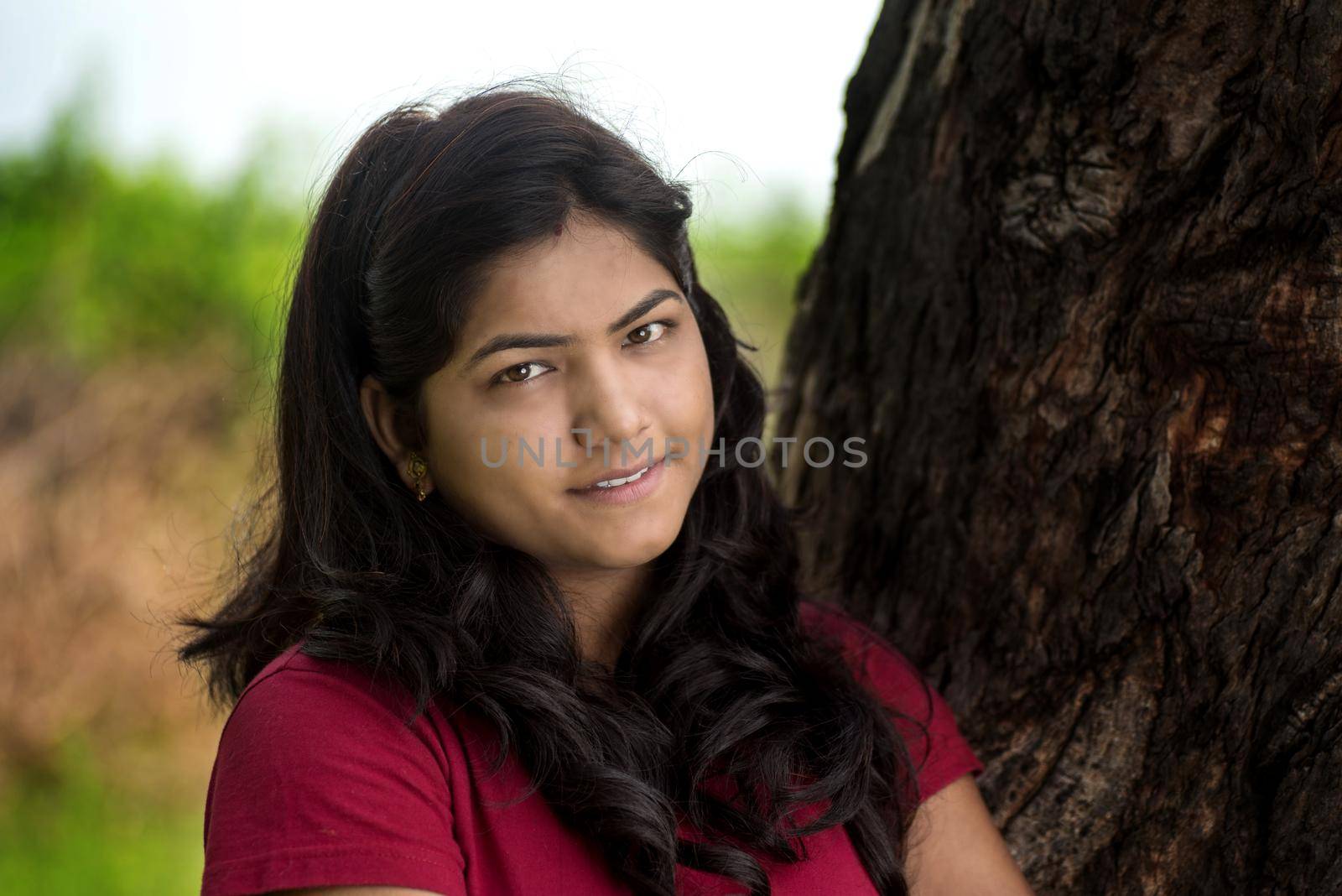 Portrait of beautiful Young girl outdoors in park.