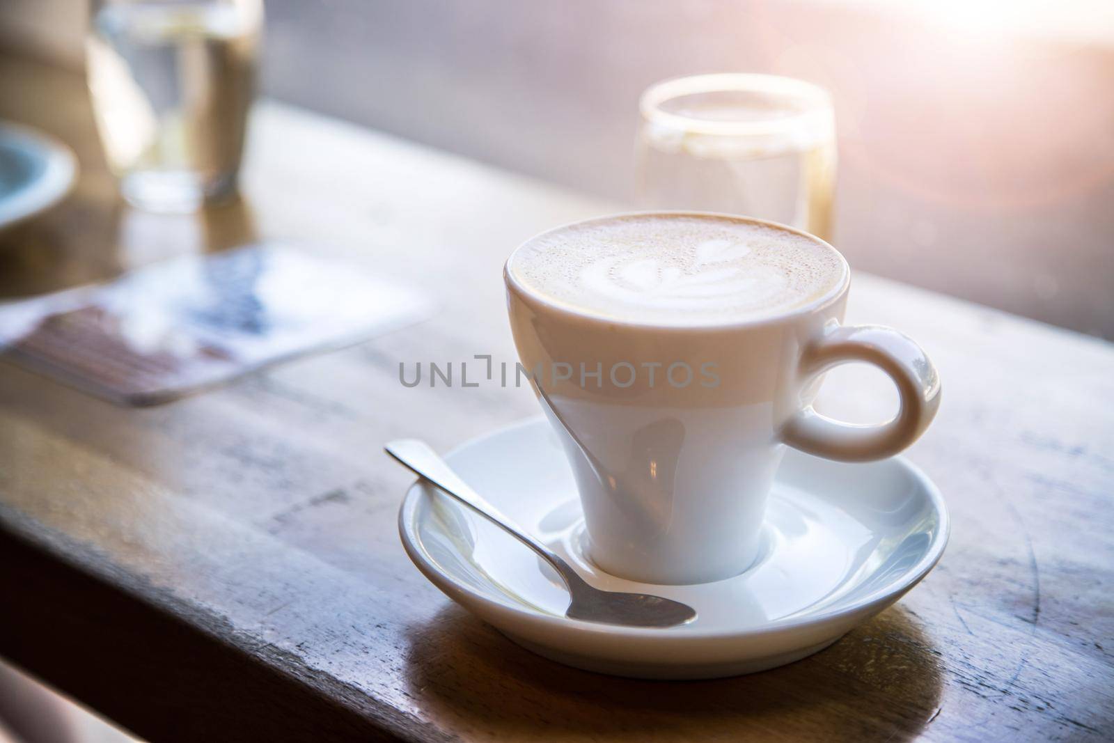 Cup of fresh brewed cappuccino in an Italian café