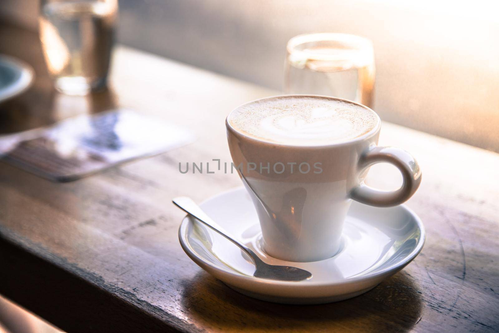 Cup of fresh brewed cappuccino in an Italian café