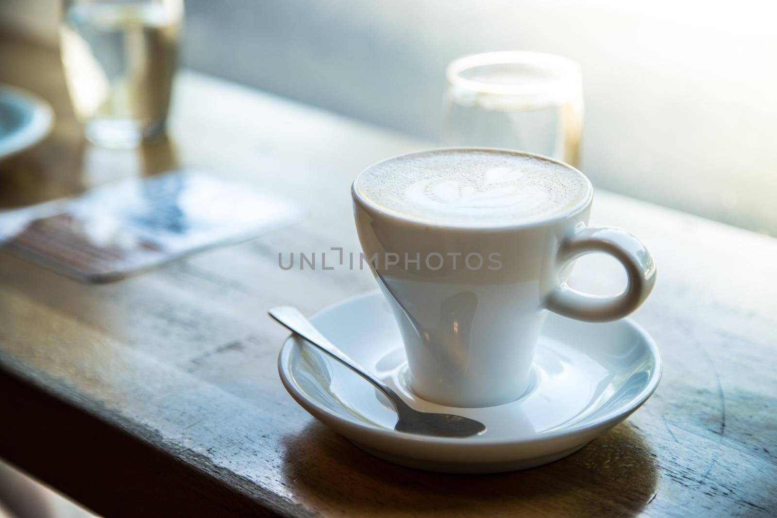 Cup of fresh brewed cappuccino in an Italian café