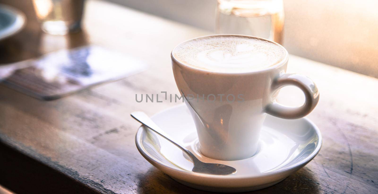 Cup of fresh brewed cappuccino in an Italian café
