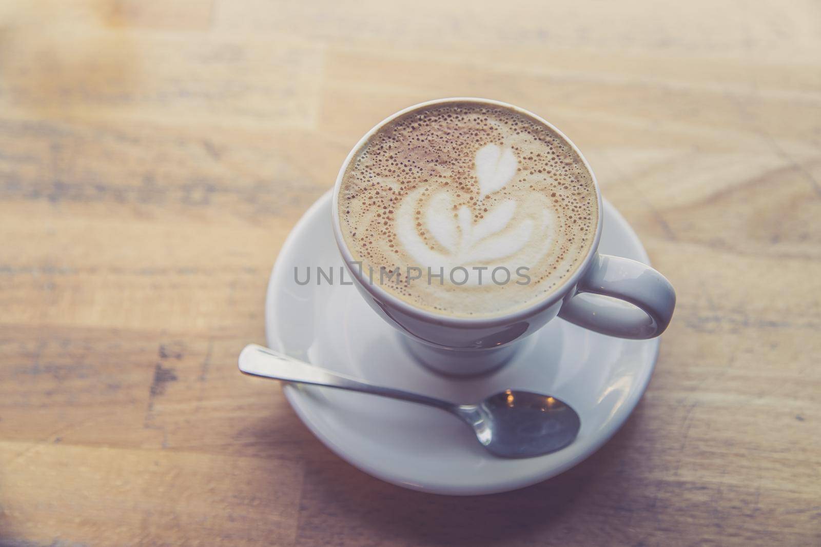 Cup of fresh brewed cappuccino in an Italian café
