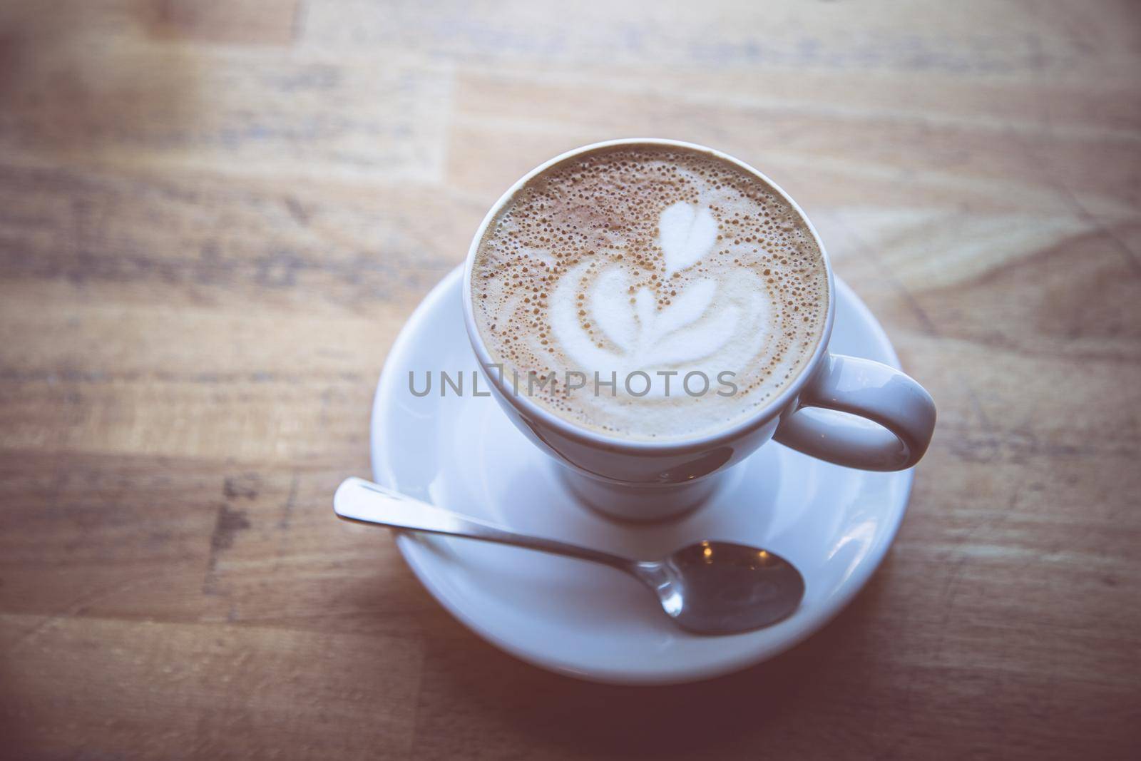 Cup of fresh brewed cappuccino in an Italian café