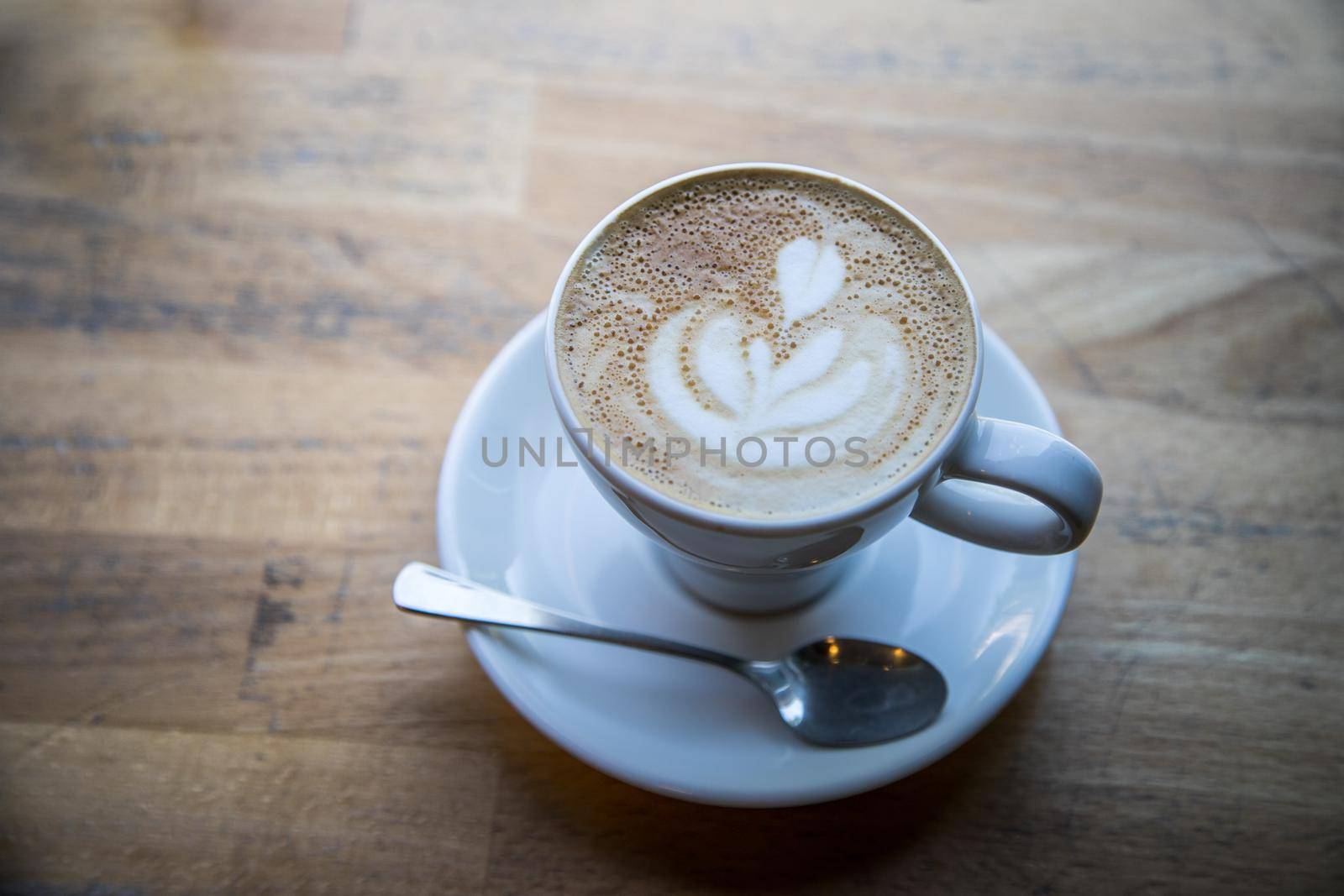 Cup of fresh brewed cappuccino in an Italian café