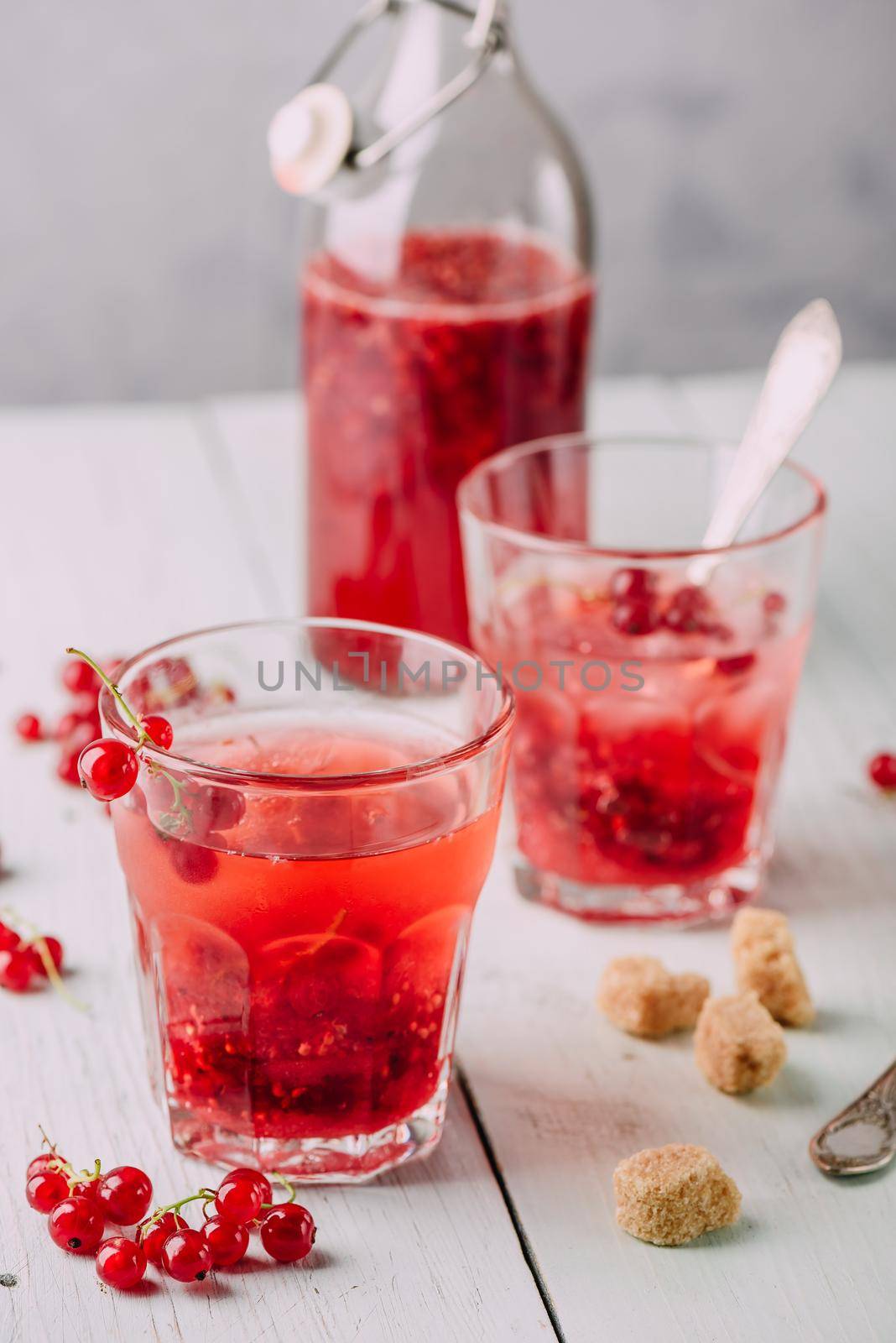 Infused water with fresh red currant and cane sugar