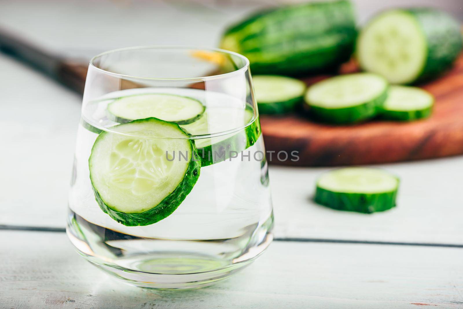 Detox water with sliced cucumber in a drinking glass