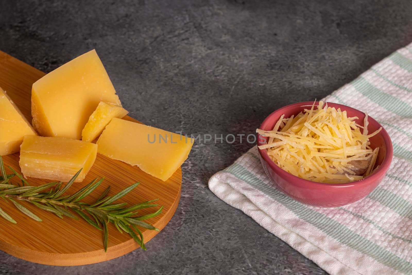 Tray with pieces of Parmesan cheese and fine herbs