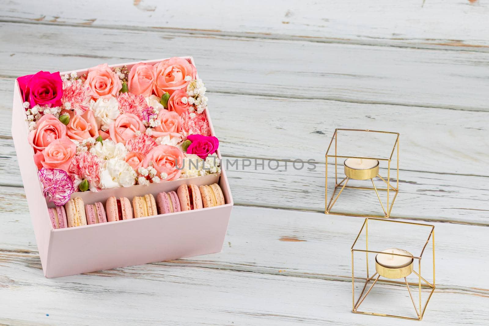 Floral arrangement of pink roses with macarons of different colors by eagg13