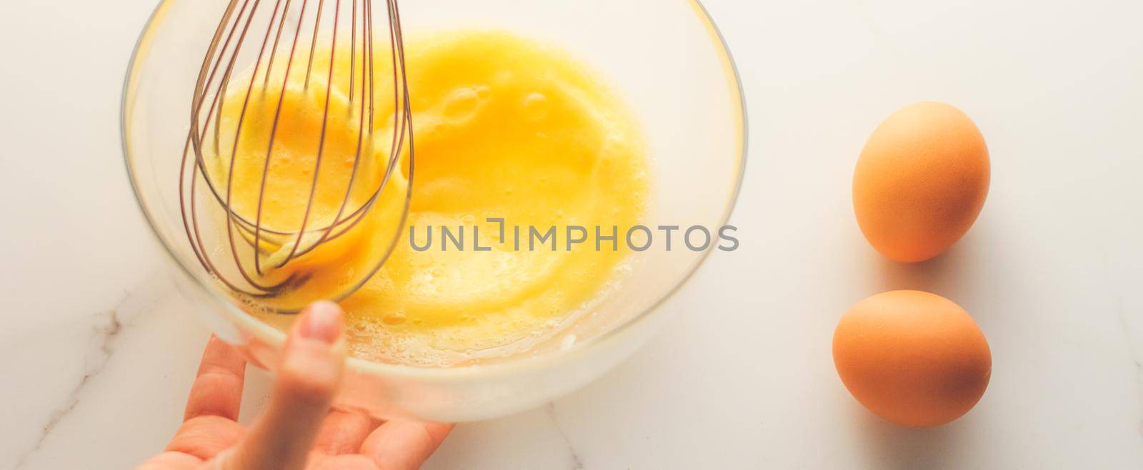 Making of mixing eggs in bowl on marble table as homemade food flat lay, top view food brand photography flatlay and recipe for cooking blog, menu or cookbook design by Anneleven