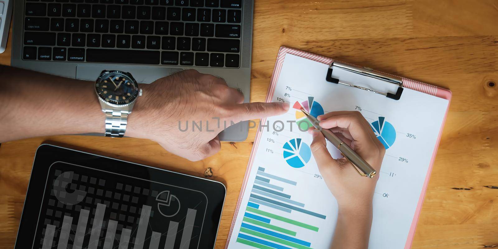 Analytics intelligence concept. Group of business people discuss current financial and economic on laptop computer for investment at the meeting. by itchaznong