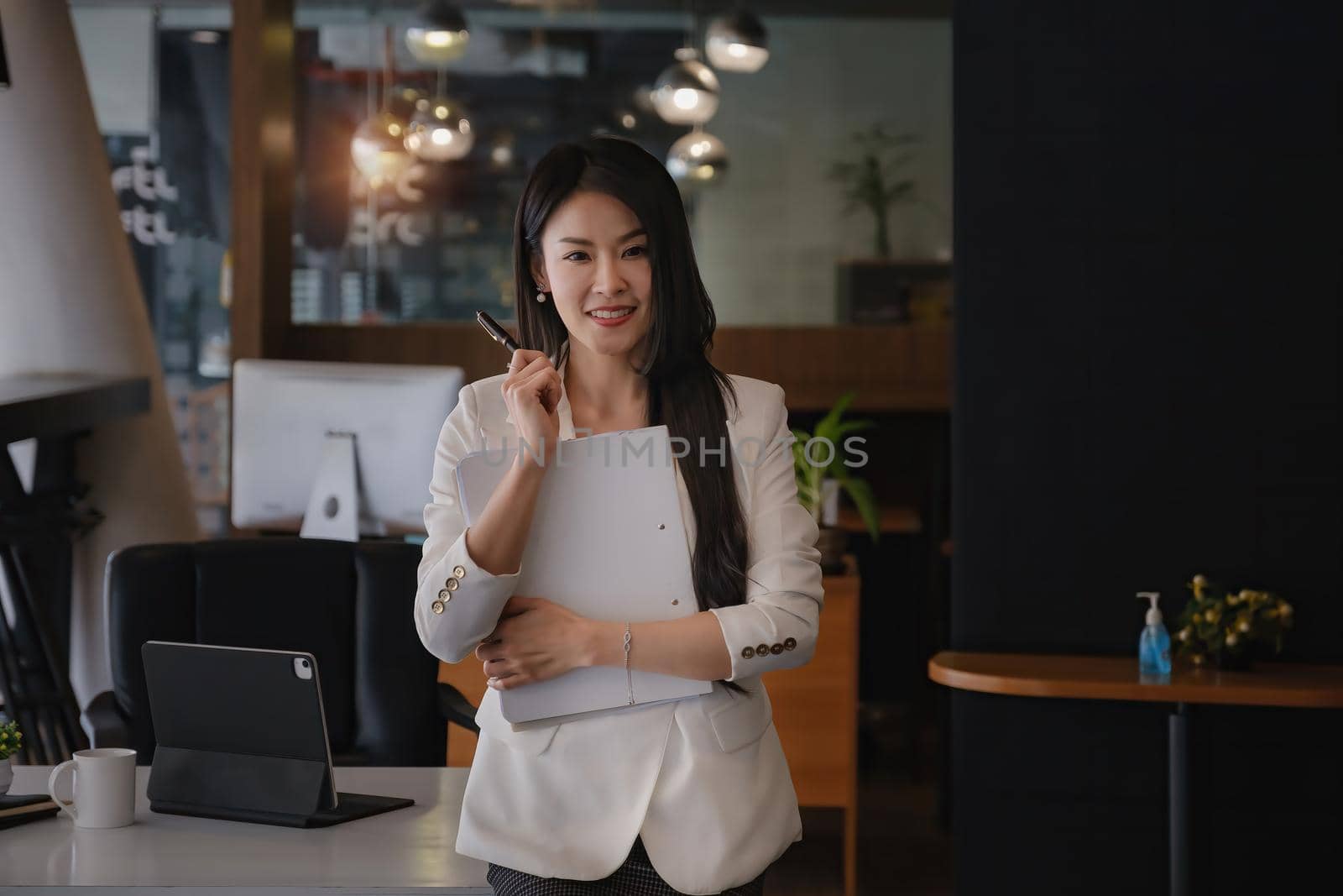 Joyful businesswoman in modern office. Smart, intelligent, friendly, concept. High quality photo