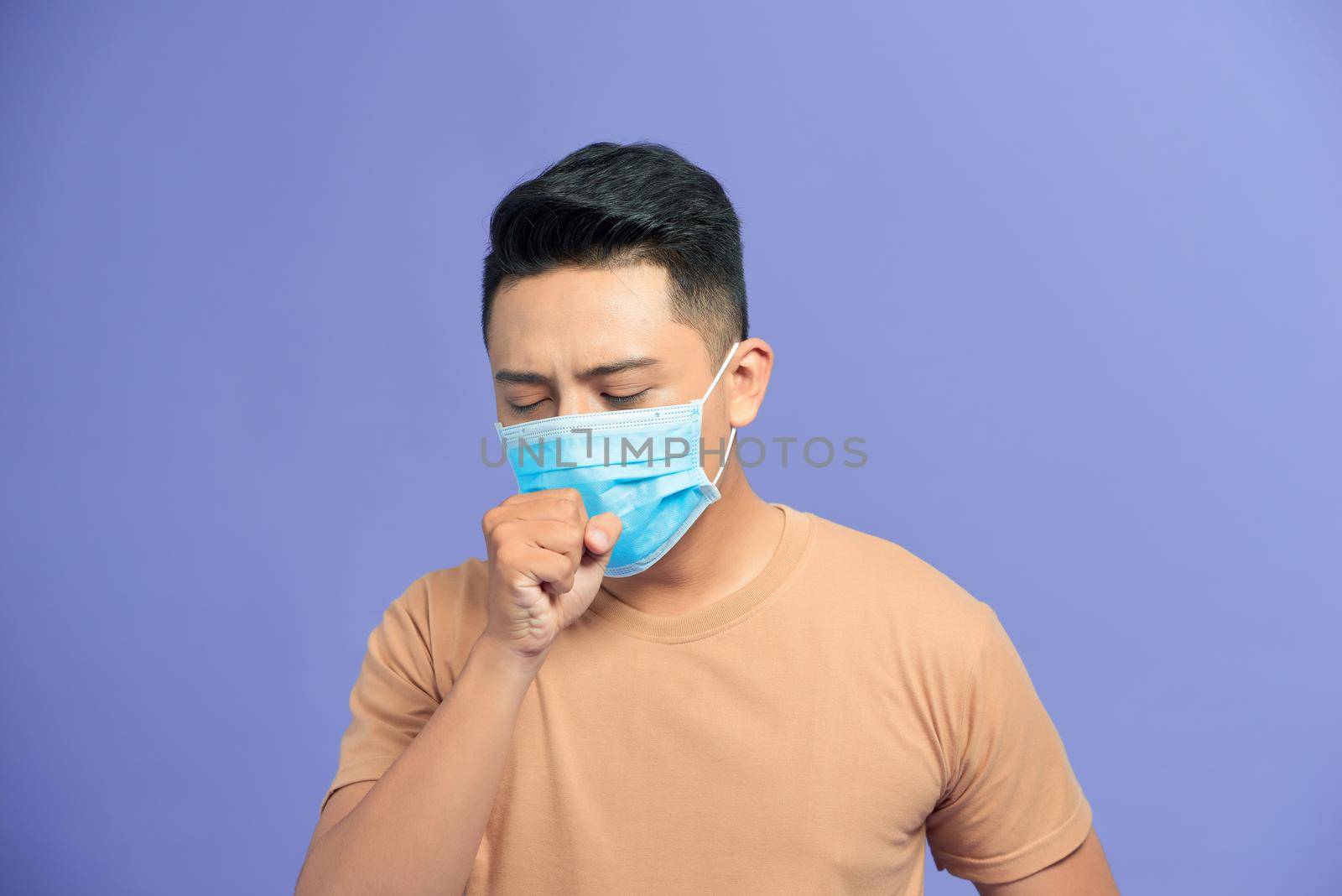 Asian man wearing a face mask with coughing