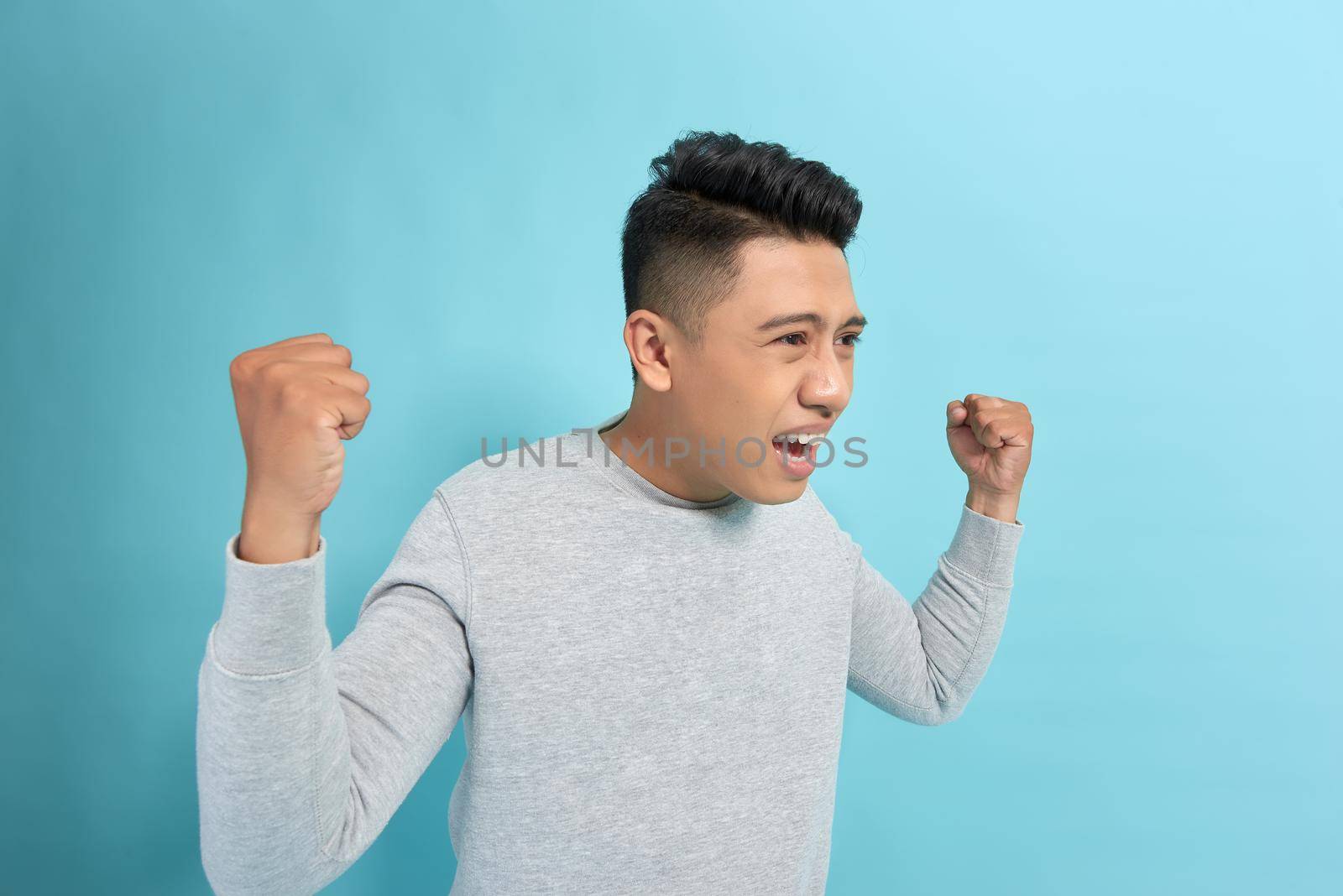 Excited businessman celebrating a win