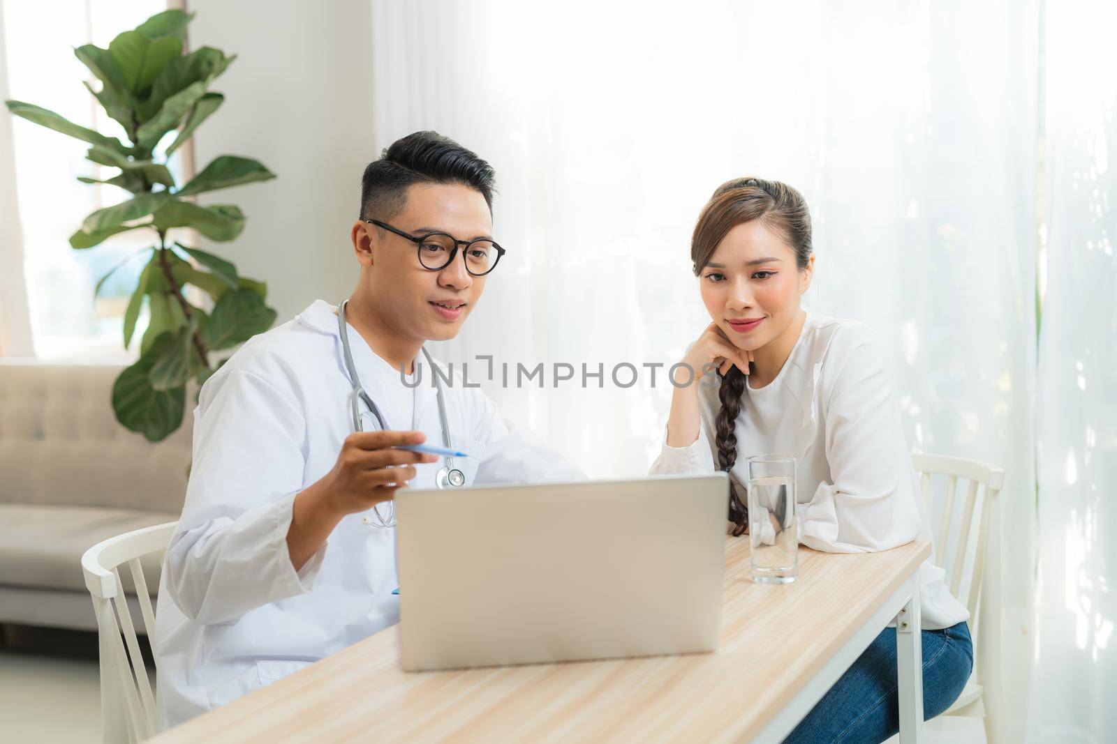 Male Obstetrician-gynecologist working with young stress woman in clinic or hospital healthcare