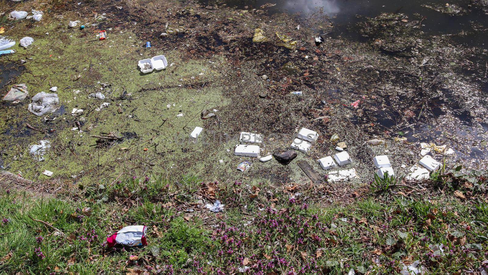 Environmental pollution found at a lake where people dumped their rubbish. by MP_foto71