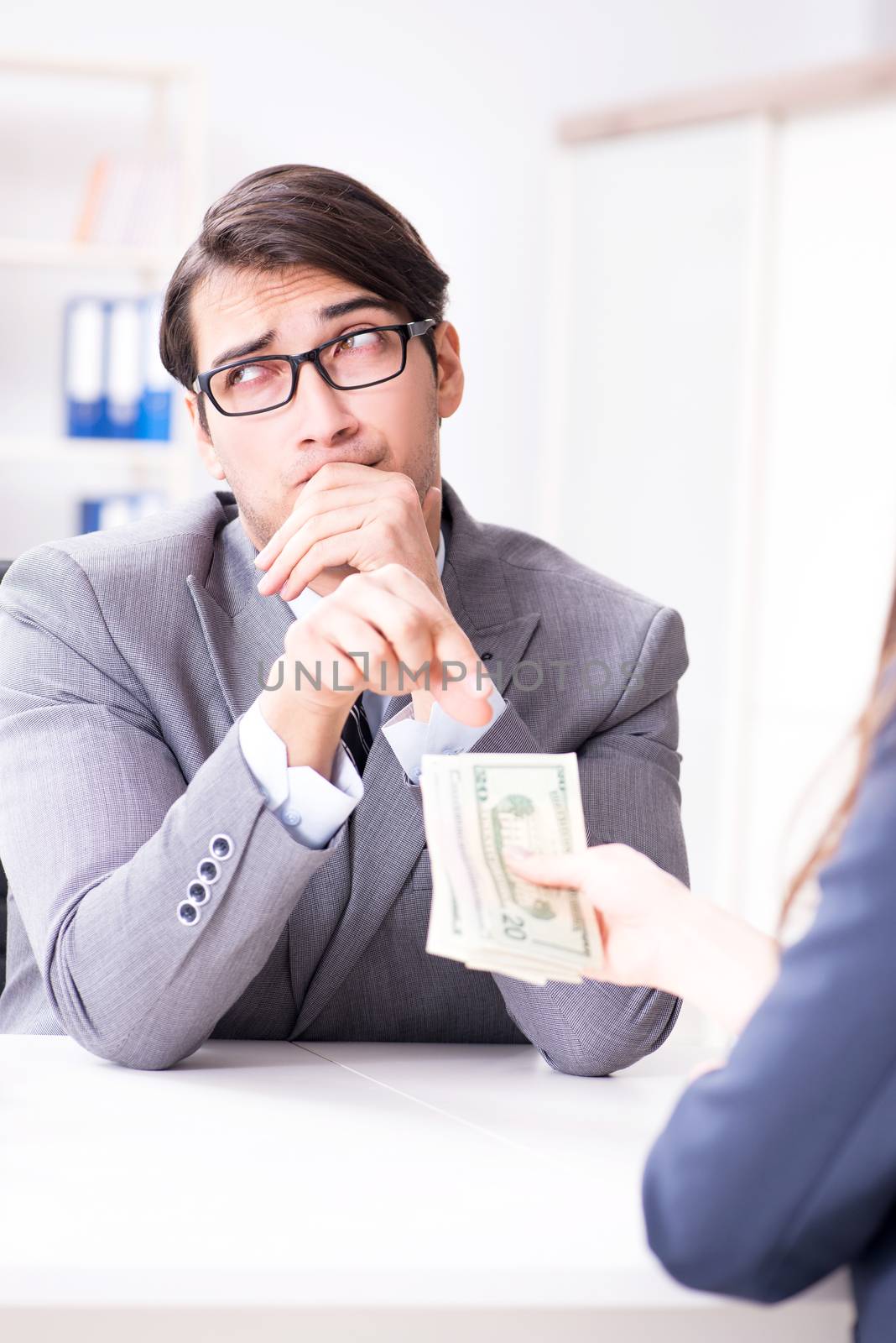 Businessman being offered bribe for breaking law