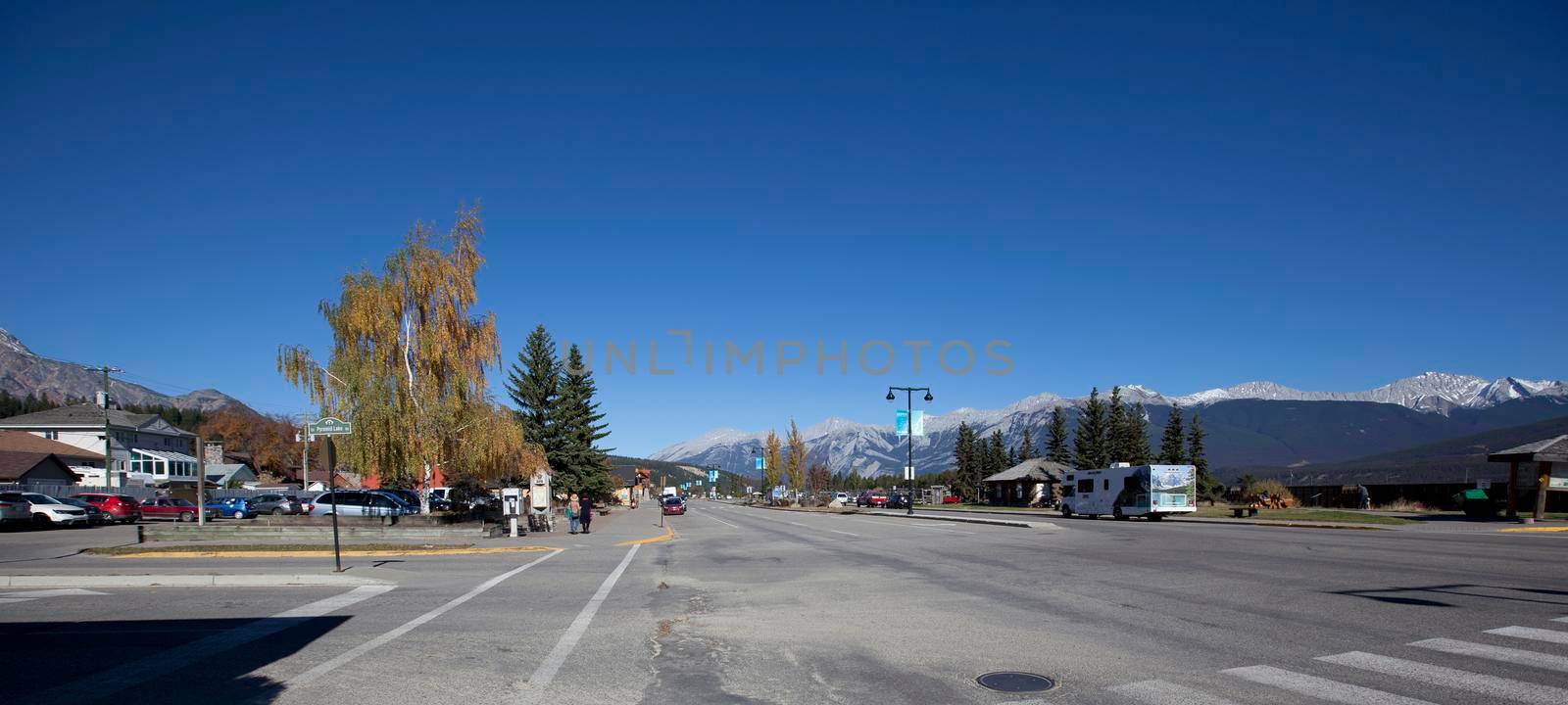  October 5, 2017: downtown Jasper, Alberta with a view of the rocky mountains on the corner of Connaught and Pyramid Lake Road