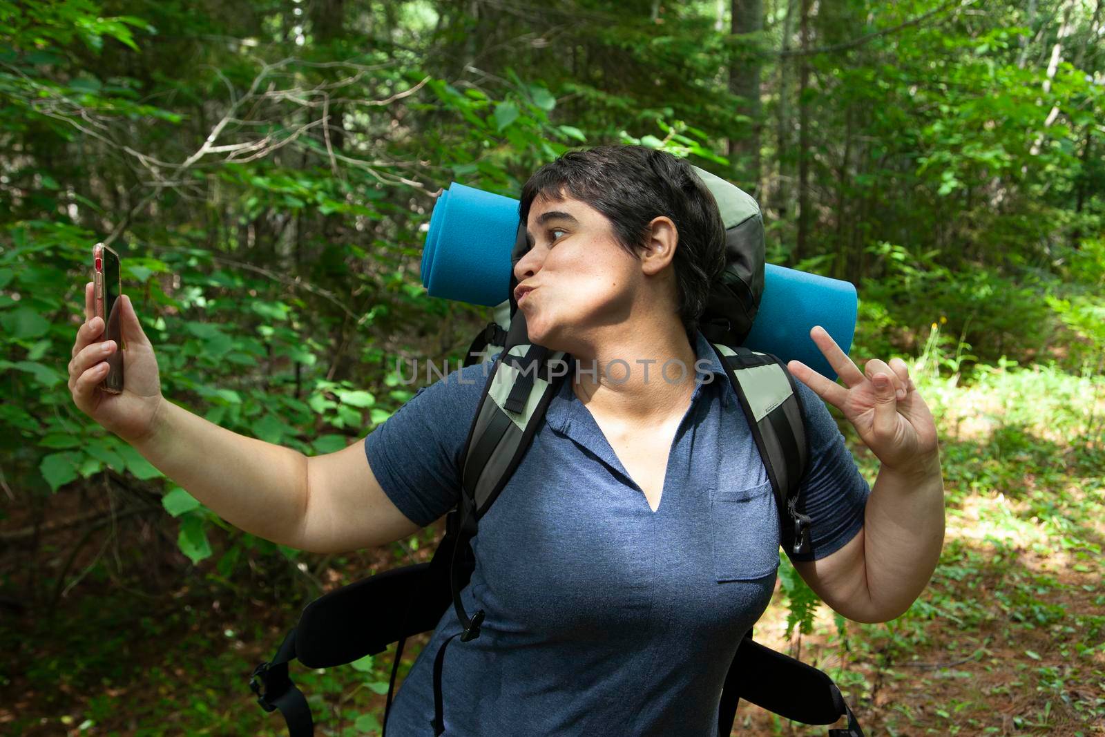 person posing for a selfie while exploring nature 