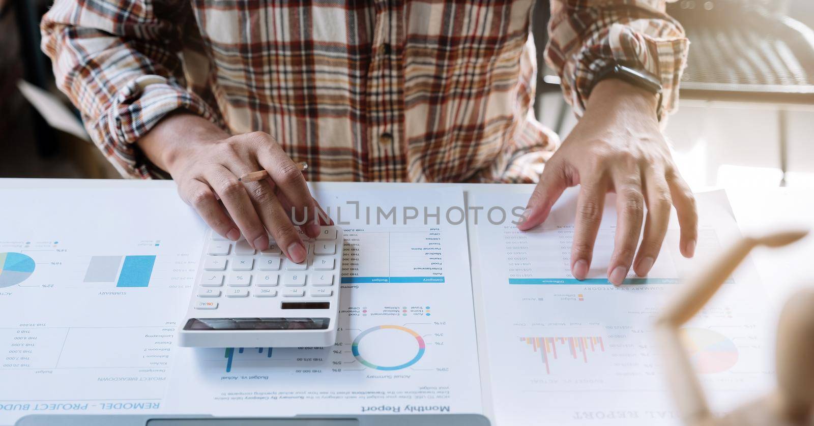 Close up business man working in finance and accounting Analyze financial budget work from home concept