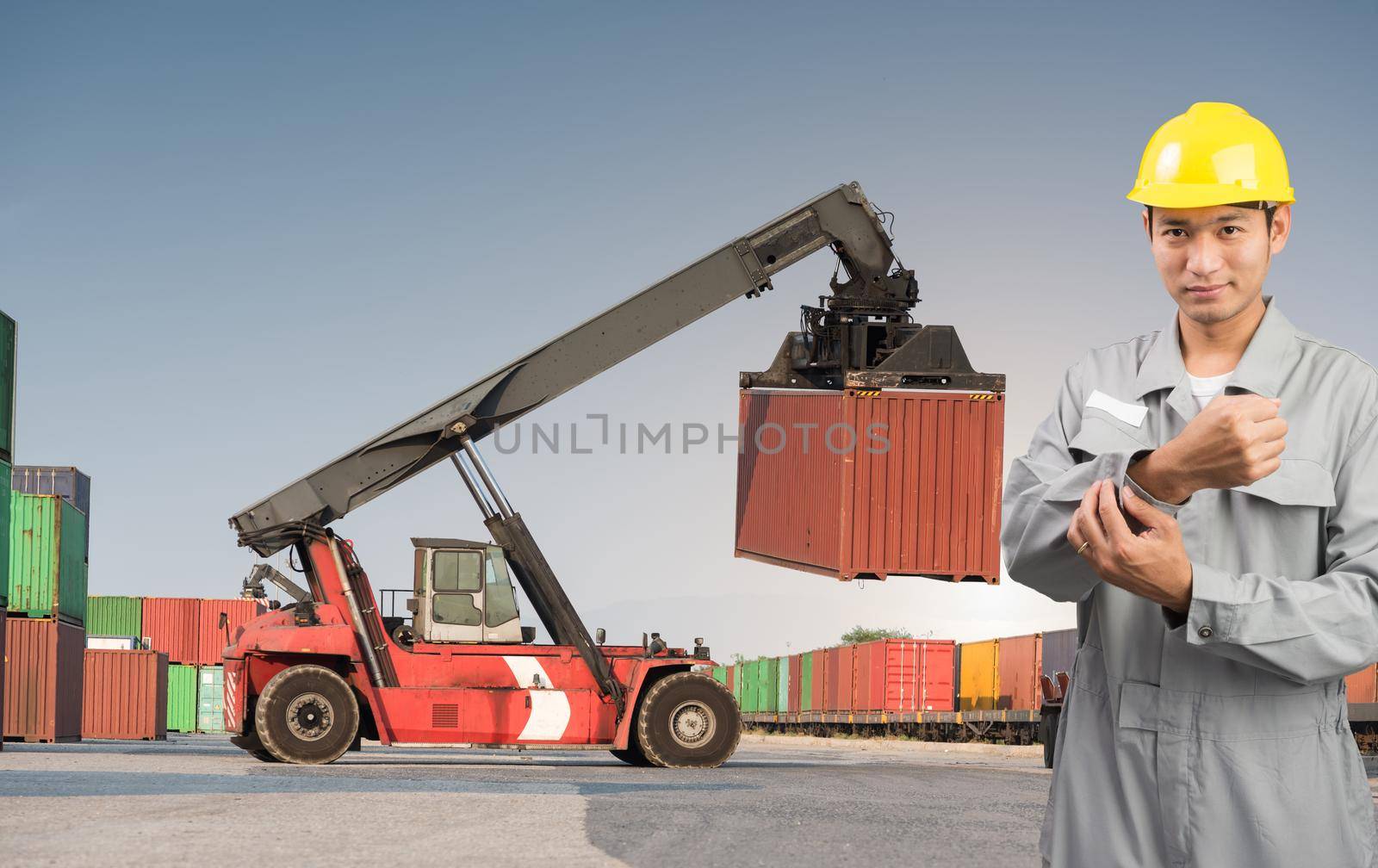 Foreman stand on front forklift loading Containers box to Logistic cargo Import Export
