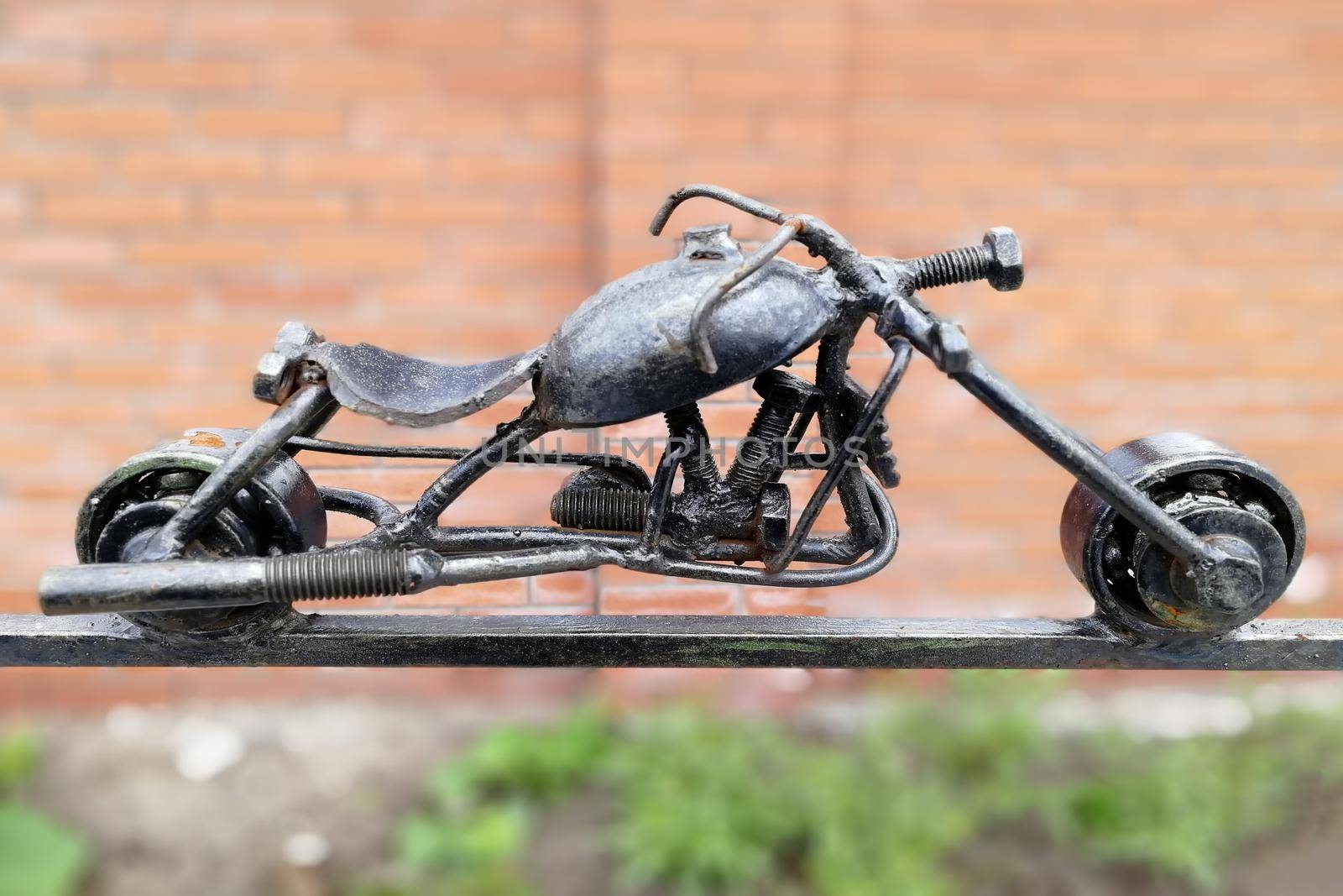 Metal motorcycle figurine. In the open. Front view. by Essffes