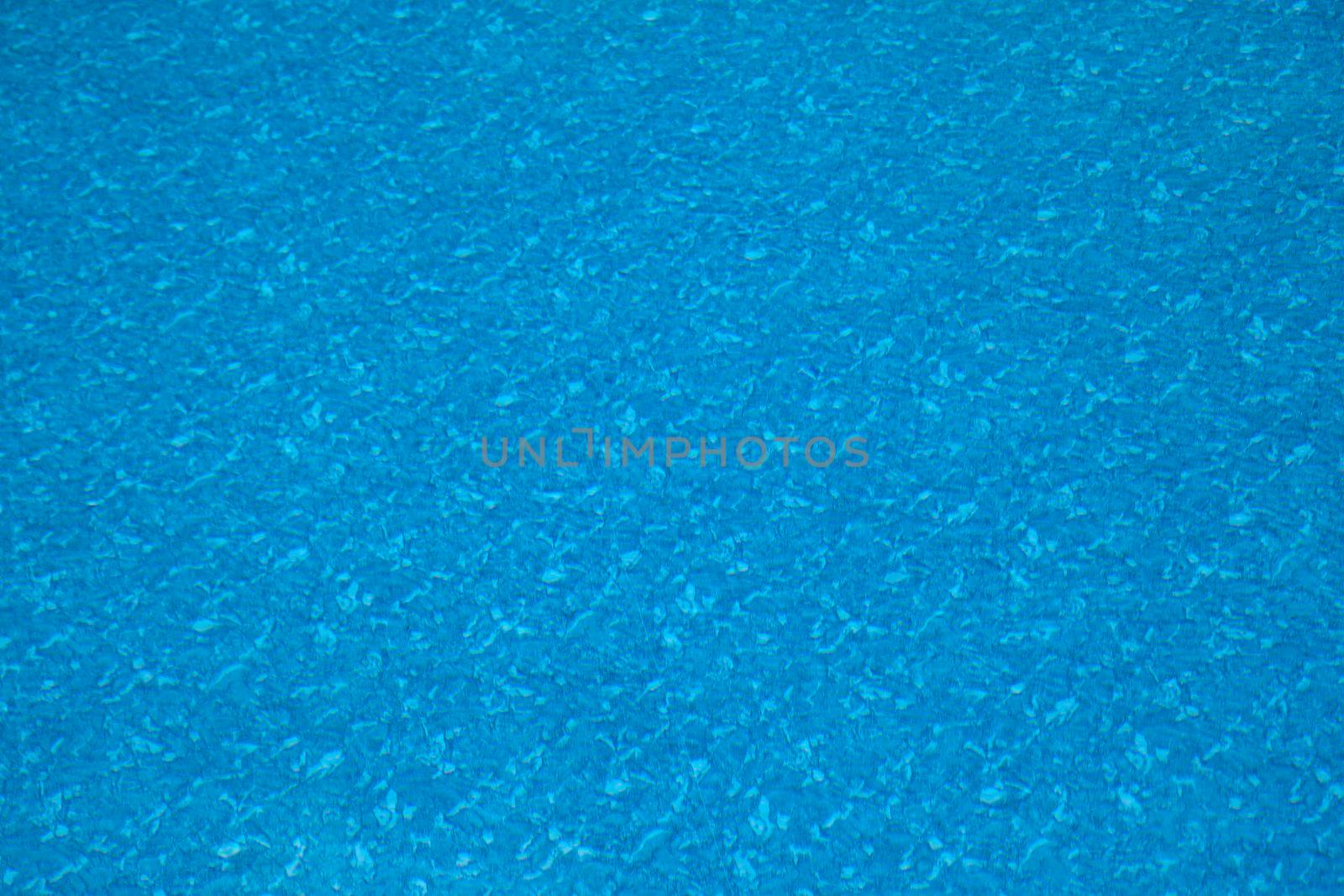 The floor or deep end of a swimming pool with underwater abstract pattern 