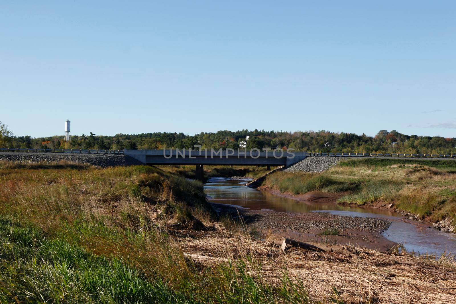 Low tide as the St Croix river flows under a bridge in Nova Scotia