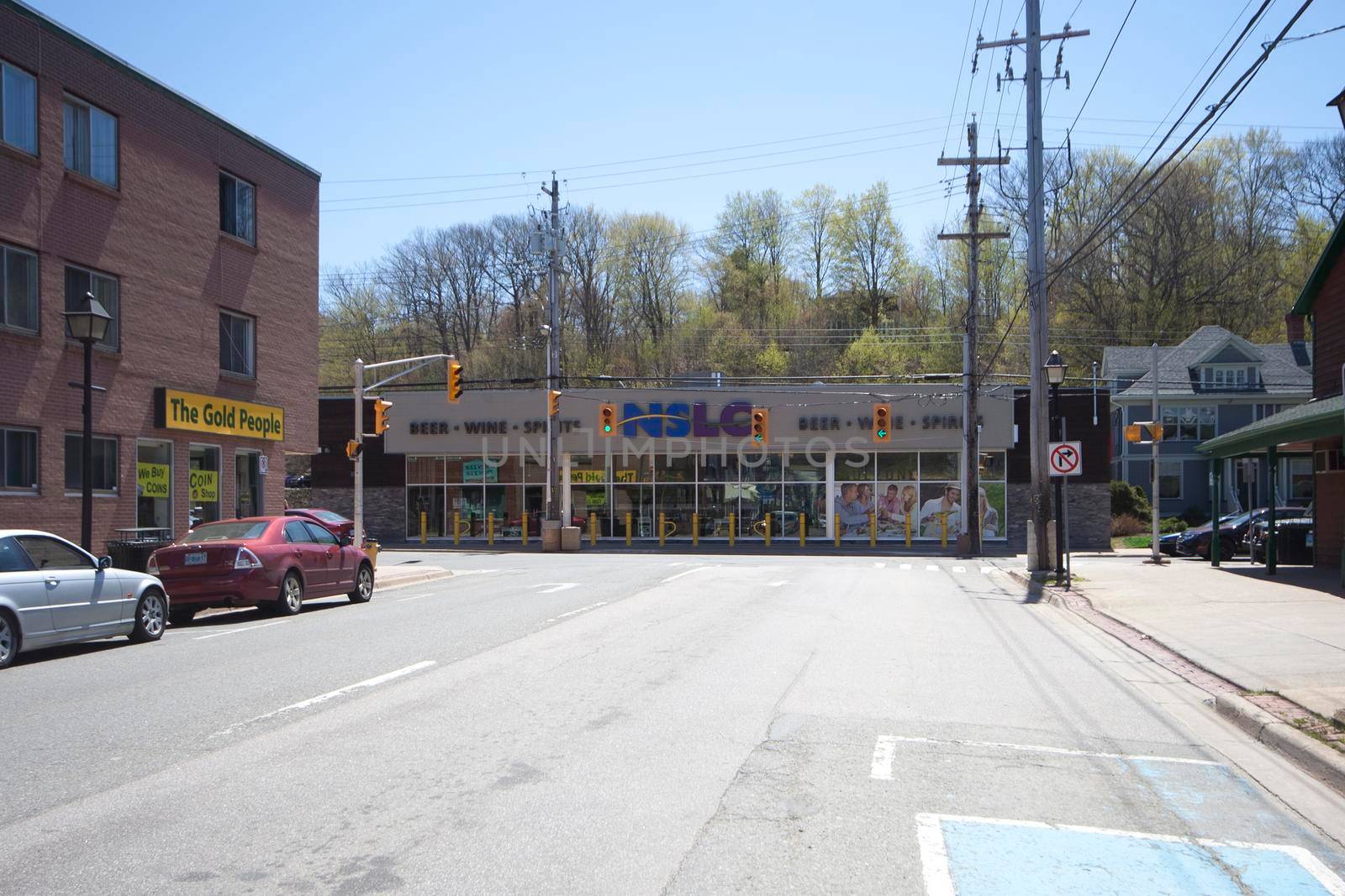 Kentville, Nova Scotia - May 7, 2013: Looking at the Nova Scotia Liquor Commission in Kentville, with other local shops nearby, at the intersection of Main and Aberdeen