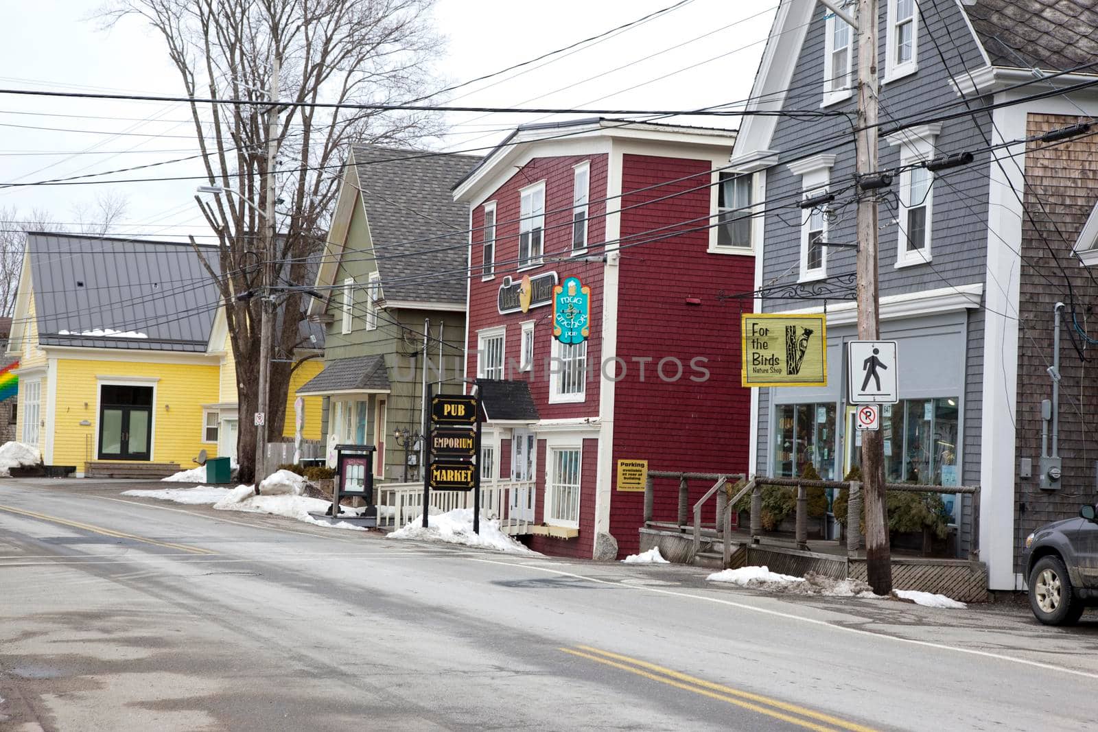 Mahone Bay, Nova Scotia - March 6, 2013: View of the local pub and hobby shop on Mahone Bay's Main drag