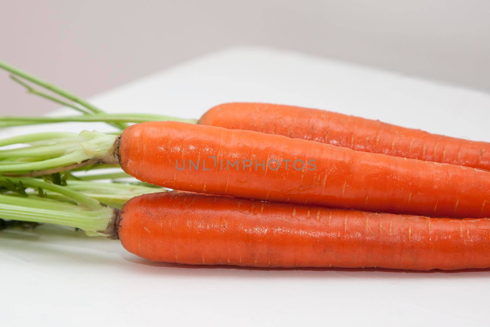 a fresh lovely bunch of healthy carrots, close up 