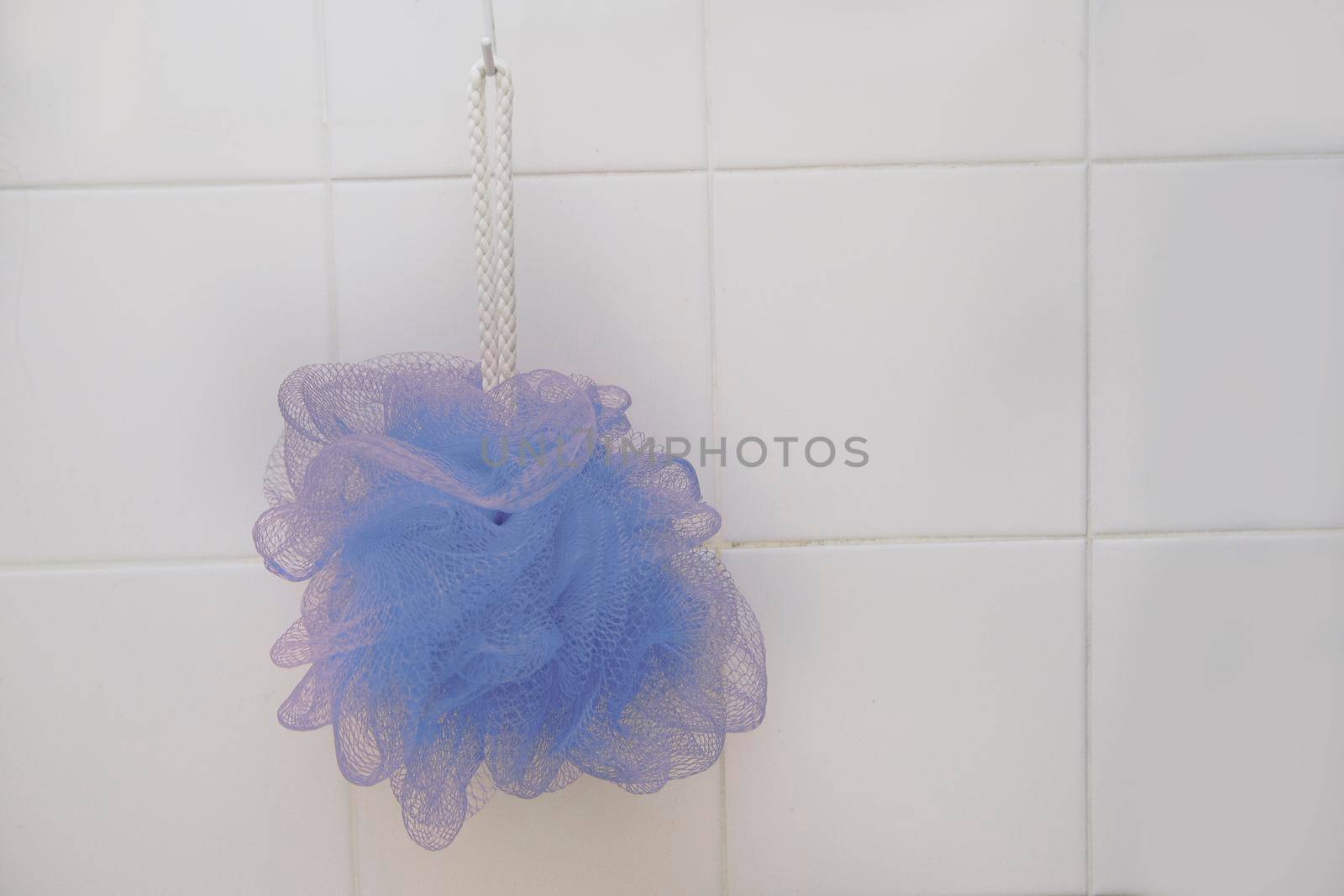 Shower with blue loofah  by rustycanuck