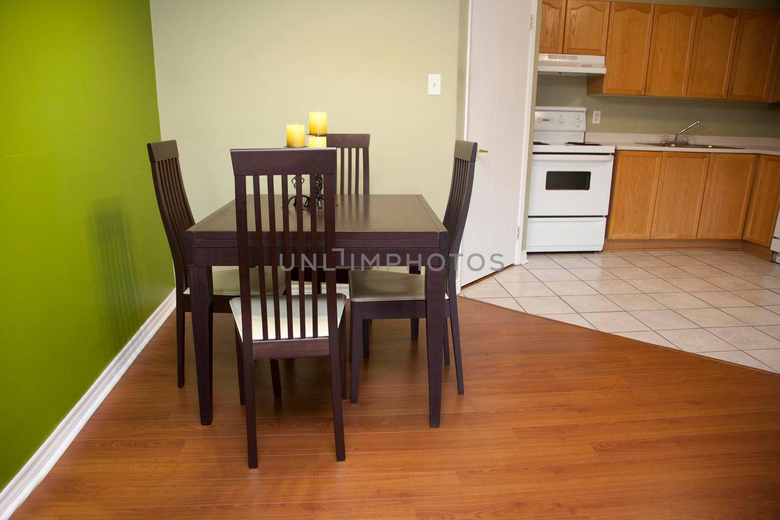 Eating area with kitchen stove in the background