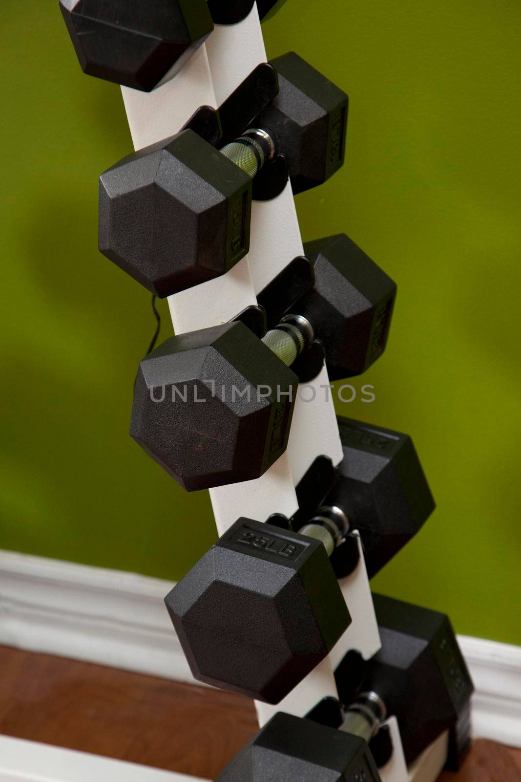 Close up stack of dumbells  by rustycanuck