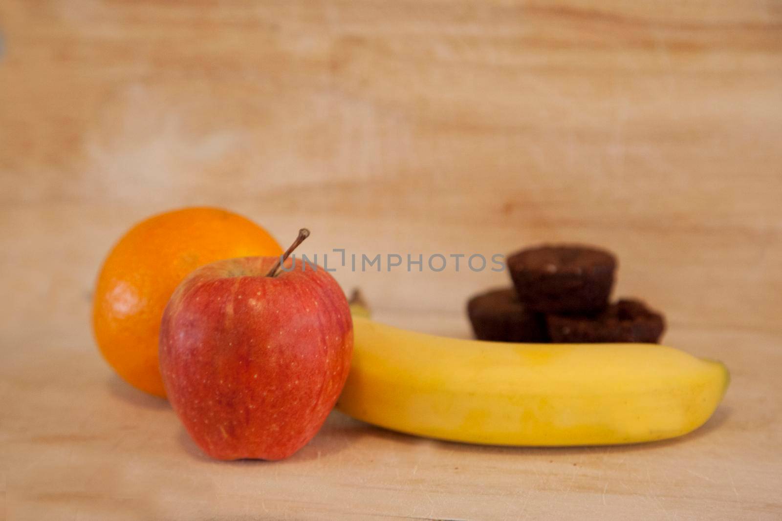 Choosing between apple, banana and orange or some small bite sized brownies