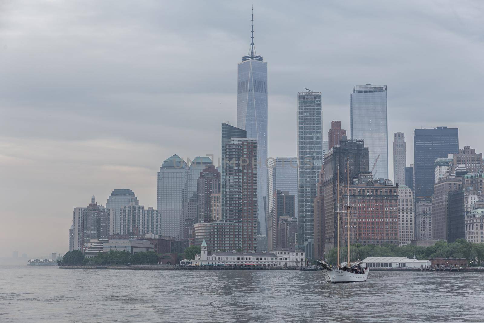 Panoramic view of storm over Lower Manhattan from Ellis Island at dusk, New York City. by kasto