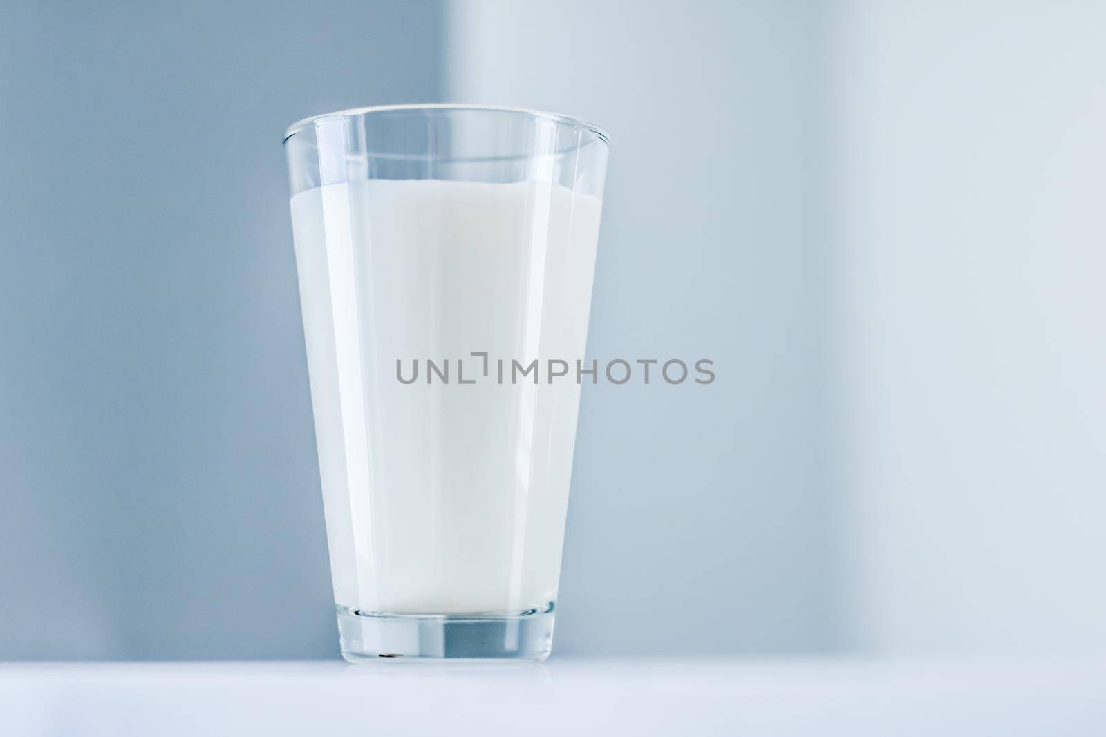 World Milk Day, full glass on marble table by Anneleven