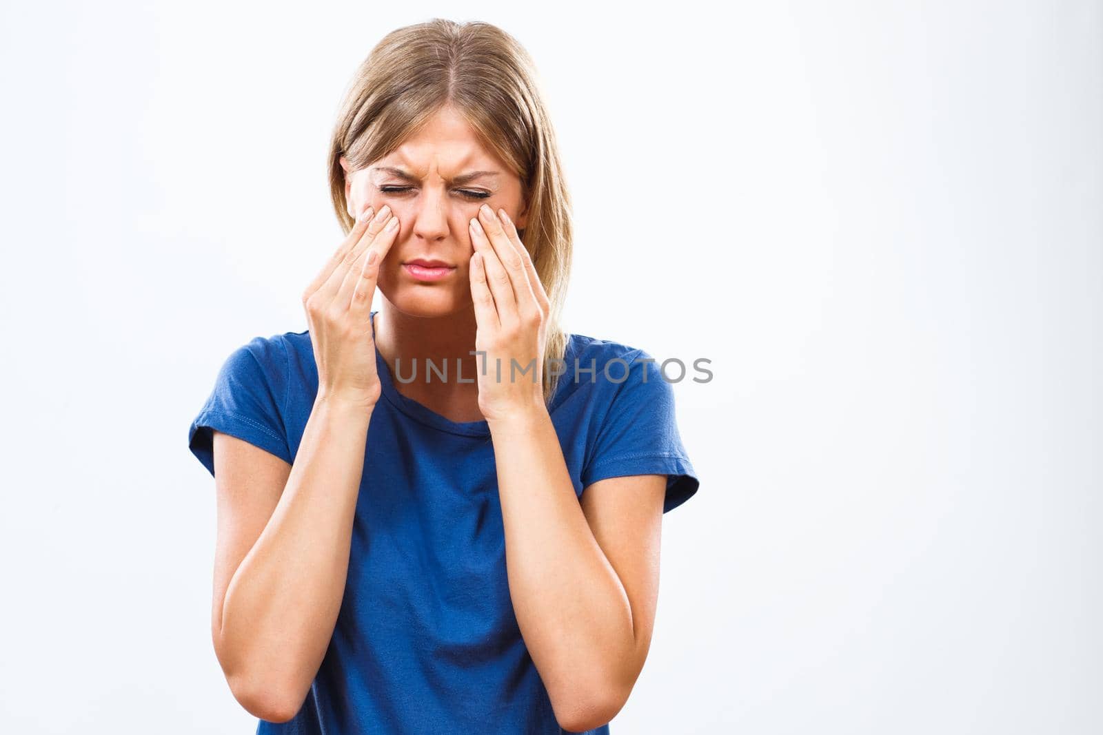 Young woman having sinusitis pain isolated on white background