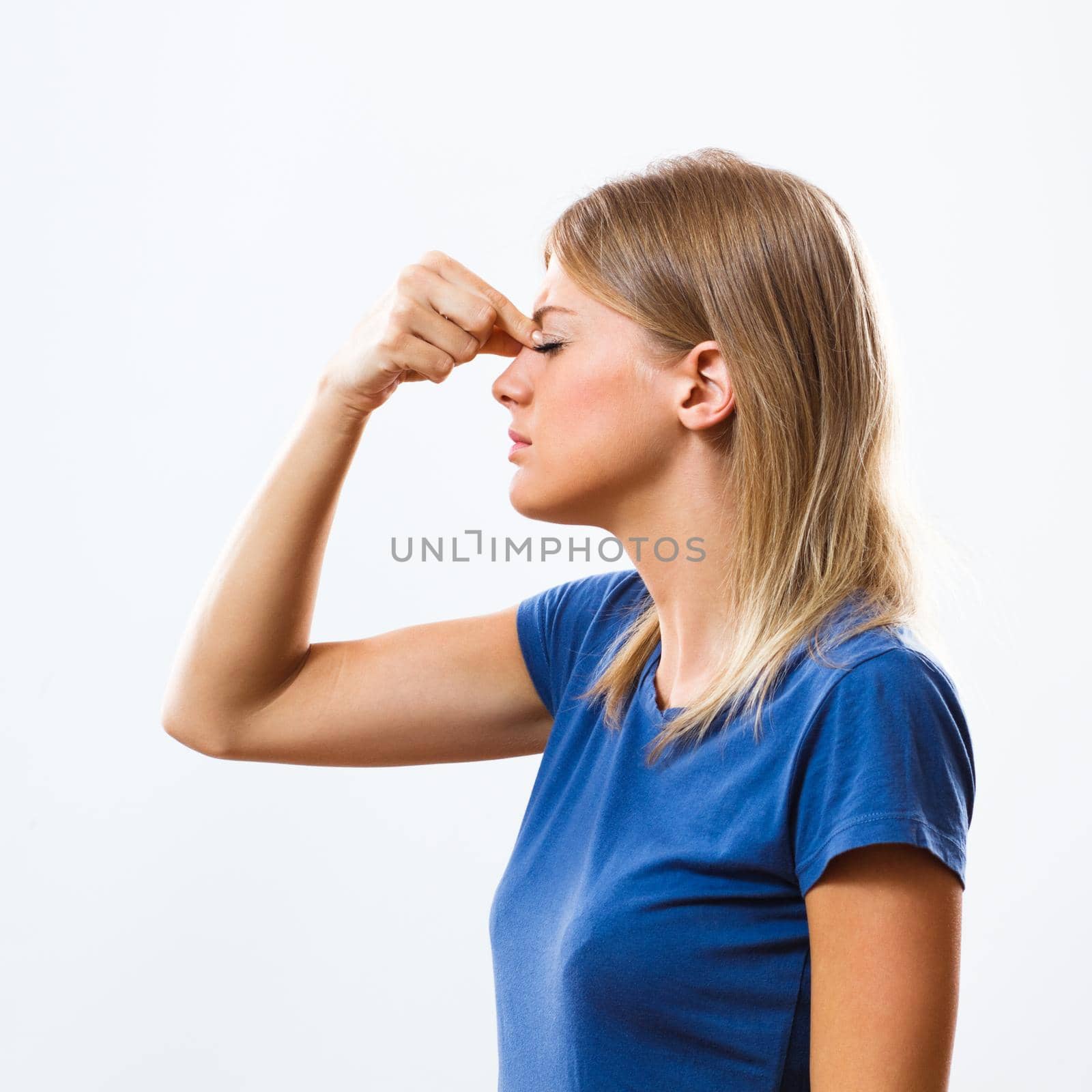 Young woman having sinusitis pain isolated on white background