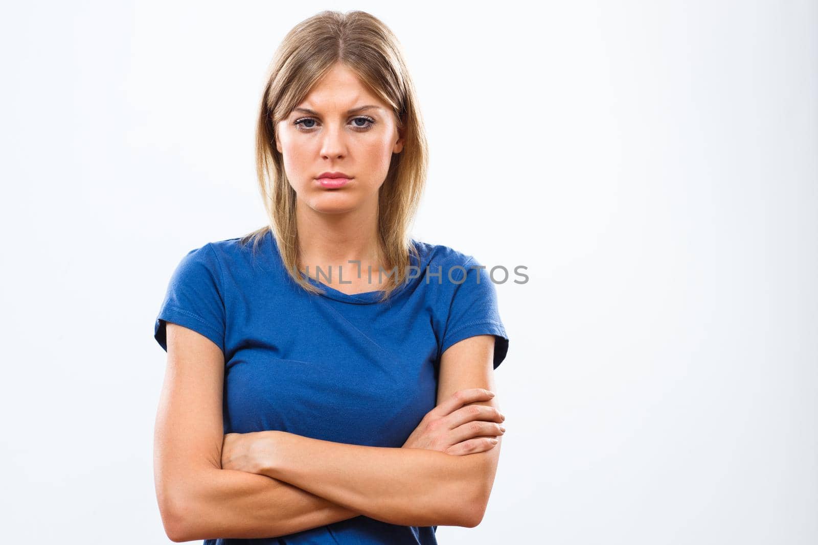 Sad young woman isolated on white background